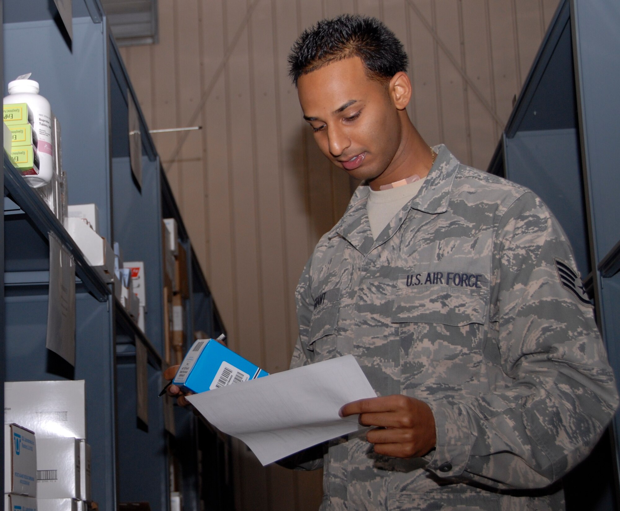 KUNSAN AIR BASE, Republic of Korea -- Staff Sgt. Gary Grant, 8th Medical Support Squadron NCO in charge of the storage and distribution operating warehouse, performs inventory in the warehouse. The warehouse is part of the 8th MDSS medical logistics flight. (U.S. Air Force photo/Staff Sgt. Amanda Savannah)