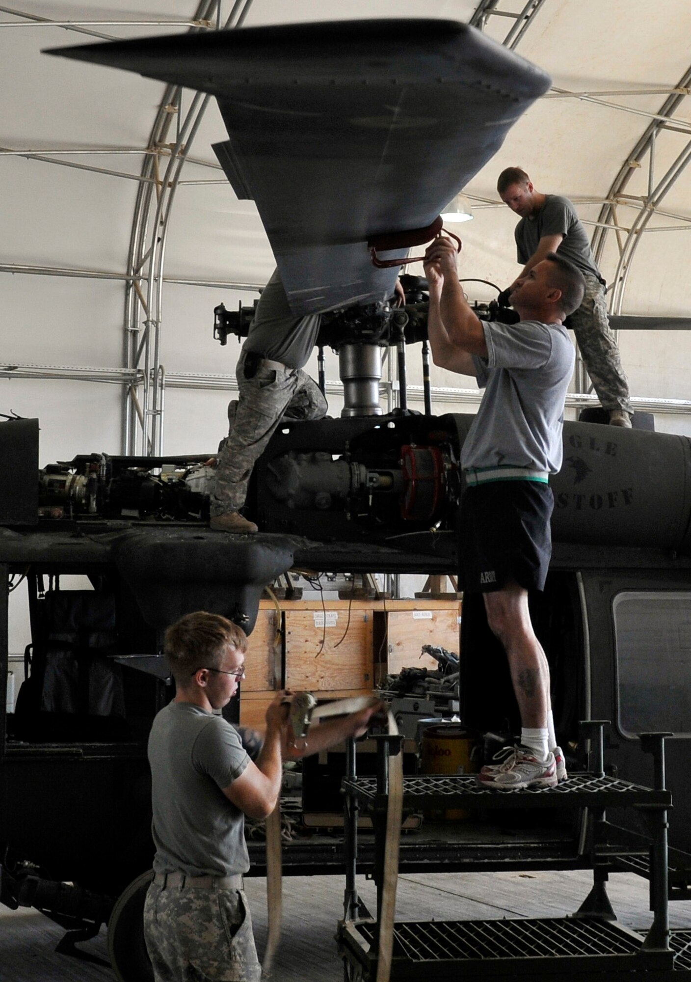 Soldiers of the Charlie Company, 7th Battalion, 101st Aviation Regiment, install a main rotor blade on a UH-60 Black Hawk after a transmission replacement Sept. 10, 2010, Joint Base Balad, Iraq.  The helicopter uses four titanium fiberglass blades to fly through the air. (U.S. Air Force photo/Staff Sgt. Phillip Butterfield)