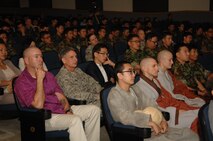 KUNSAN AIR BASE, Republic of Korea -- Members of the 8th Fighter Wing and 38th Fighter Group, Republic of Korea Air Force, listen to American monk Musim speak to the audience in the theater here Sept. 15. Monk Musim's lecture on the common ground between Zen and science and their harmony in modern society was aimed at boosting morale of the ROK and U.S. Airmen here and increasing mutual understanding between them. (Republic of Korea Air Force photo/Courtesy photo)