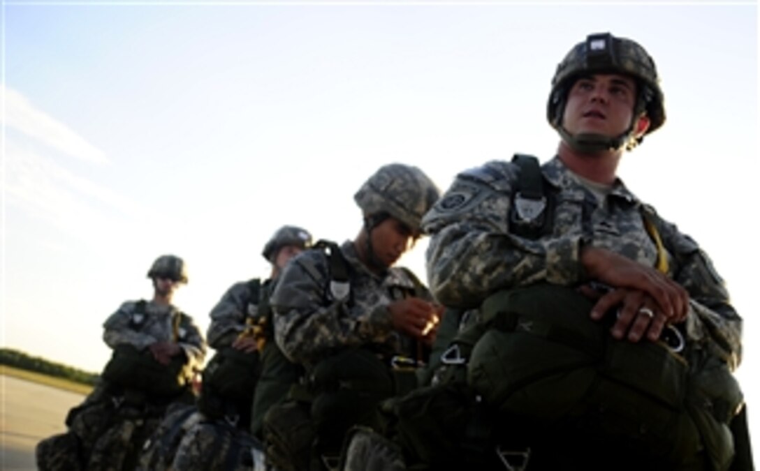 U.S. Army soldiers assigned to the 82nd Airborne Division walk onto a C-17 Globemaster III aircraft prior to a parachute drop during a joint forcible entry exercise at Pope Air Force Base, N.C., on Sept. 14, 2010.  A joint forcible entry exercise is held six times a year to enhance cohesiveness between the Air Force and the Army.  