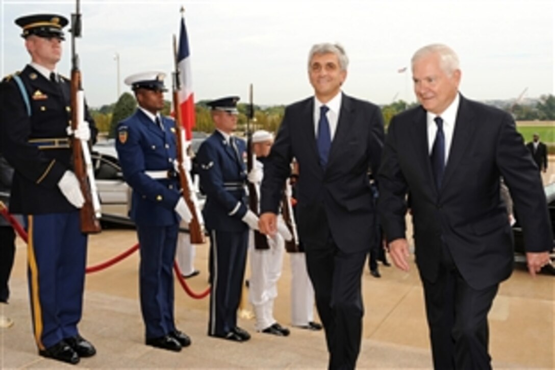 U.S. Defense Secretary Robert M. Gates, right, escorts French Minister of Defense Herve Morin, left, into the Pentagon for a luncheon meeting, Sept. 16, 2010.  