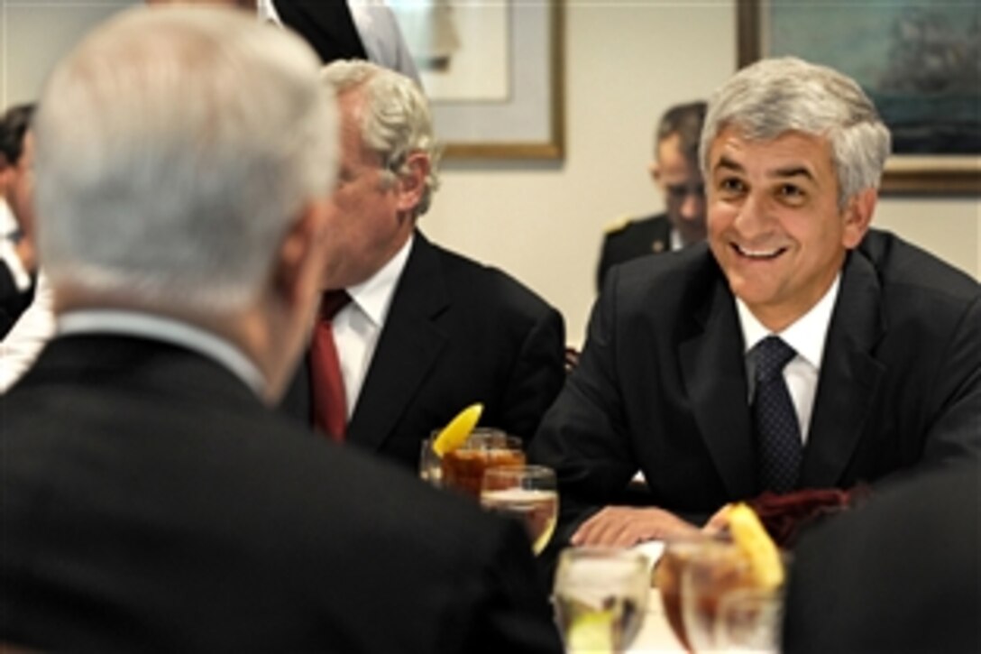 French Defense Minister Herve Morin, right, joins U.S. Defense Secretary Robert M. Gates, left foreground, for a working lunch in the Pentagon, Sept. 16, 2010,