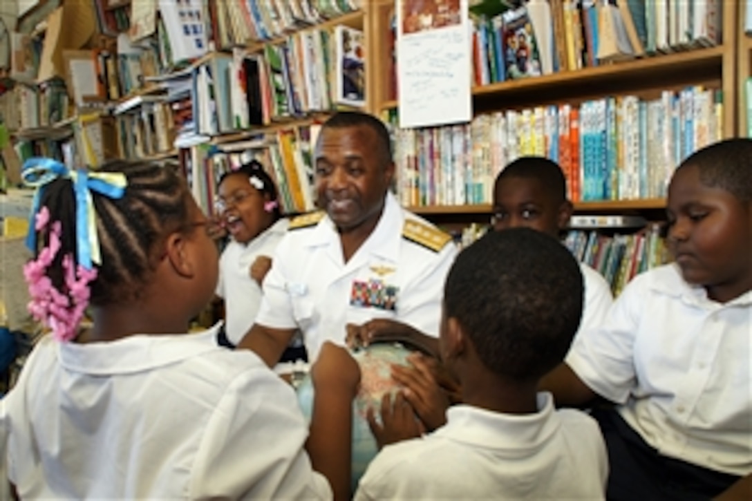 U.S. Navy Rear Adm. Arthur Johnson, commander of Naval Safety Center, speaks with students at the Sue Duncan Children's Center in Chicago, Sept. 7, 2010. Johnson visited Chicago as part of the Navy's continuing city outreach initiative. 