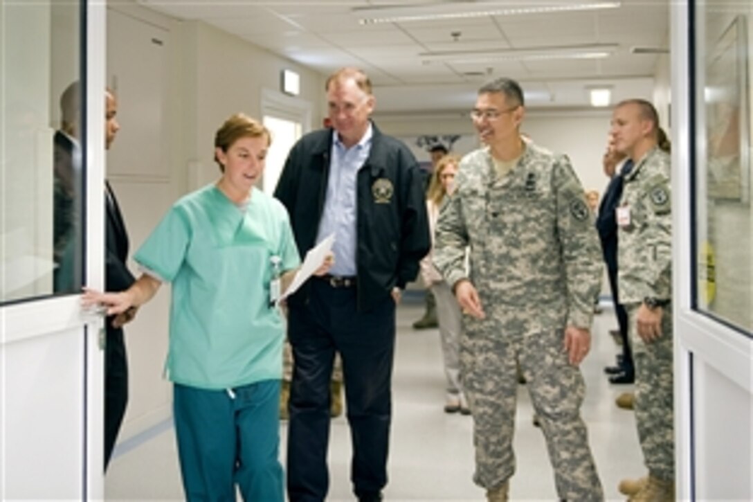 Deputy Defense Secretary William J. Lynn III, second from left, visits Landstuhl Regional Medical Center, Germany, Sept. 16, 2010. Lynn met with hospital staff to discuss funding issues before meeting with wounded servicemembers, both U.S. and coalition, in several medical surgical wards and the intensive care unit.