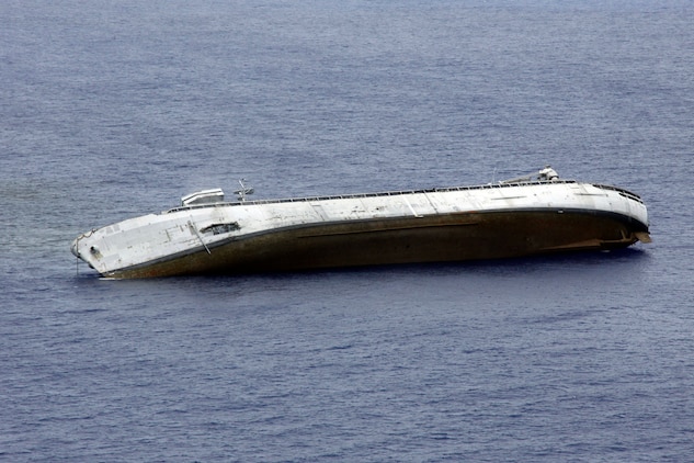 The former USS Acadia lays on its side in the Pacific Ocean after being fired upon by multiple Air Force, Marine and Navy units during a live-fire exercise which was part of exercise Valiant Shield 2010 Monday. Before being sunk, the former USS Acadia made numerous Western Pacific and Far East deployments and earned multiple awards before being decommissioned in 1994.