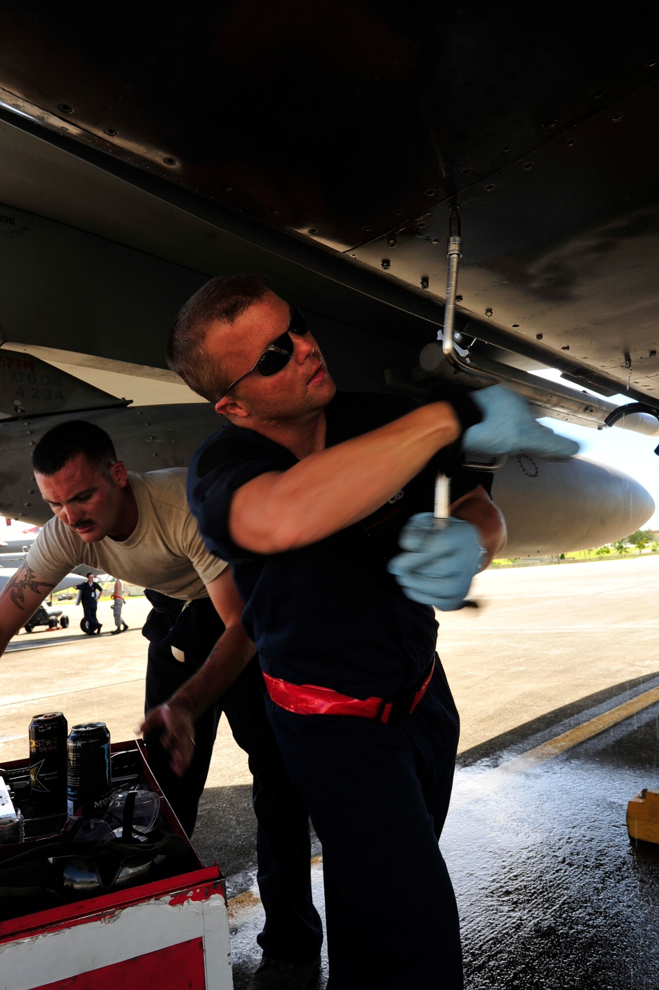 United States Air Force dedicated crew chiefs Staff Sgt Travis Oborney and Staff Sgt. Jason Millett, both with the 67th Fighter Squadron prepare to change the airframe mounted accessory drive on an F-15C during the Valiant Shield exercise here at Andersen Air Base, Guam September 17, 2010. The exercise demonstrates the organizations collective capacity to manage the mission efficiently. (USAF photo by Staff Sgt Lakisha A. Croley (U.S. Air Force Photo/Staff Sgt. Lakisha A. Croley)