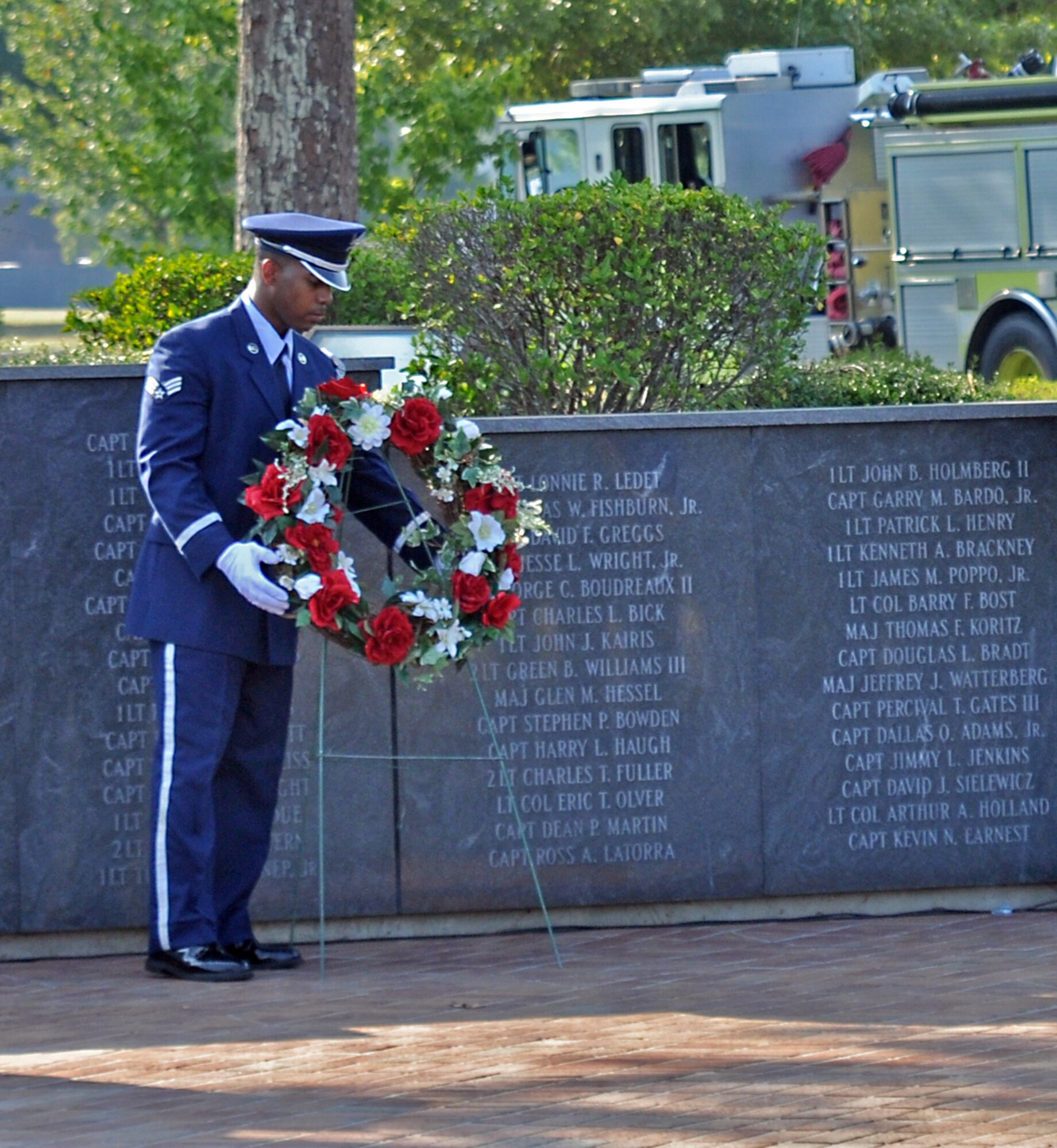Senior Airman Chris Jones, Columbus Air Force Base Honor Guard, lays a wreath during the POW/MIA Remembrance Ceremony, Sept. 17 at Columbus Air Force Base, Miss. The wreath was laid in remembrance of those that are lost, but not forgotten. (U.S. Air Force photo/Staff Sgt. Jacob Corbin).