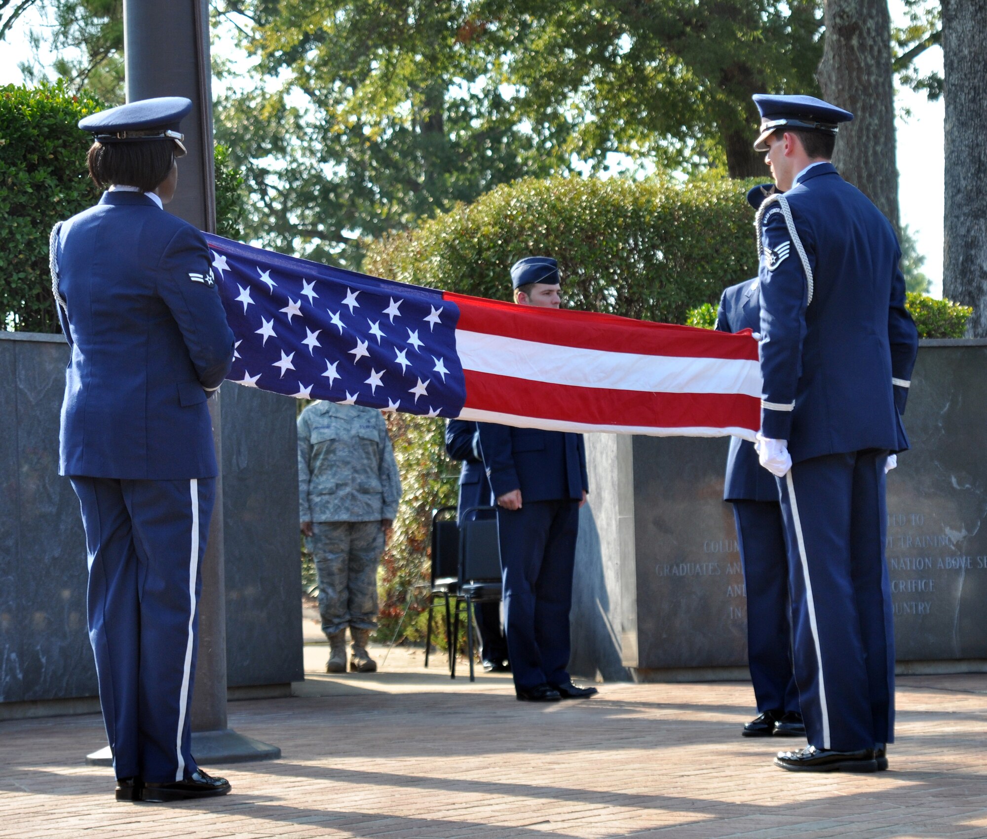 Columbus Air Force Base Honor Guard members fold the U.S. flag during a retreat ceremony held during the POW/MIA Remembrance Ceremony, Sept. 17 at Columbus AFB’s Smith Plaza. (U.S. Air Force photo/Staff Sgt. Jacob Corbin).