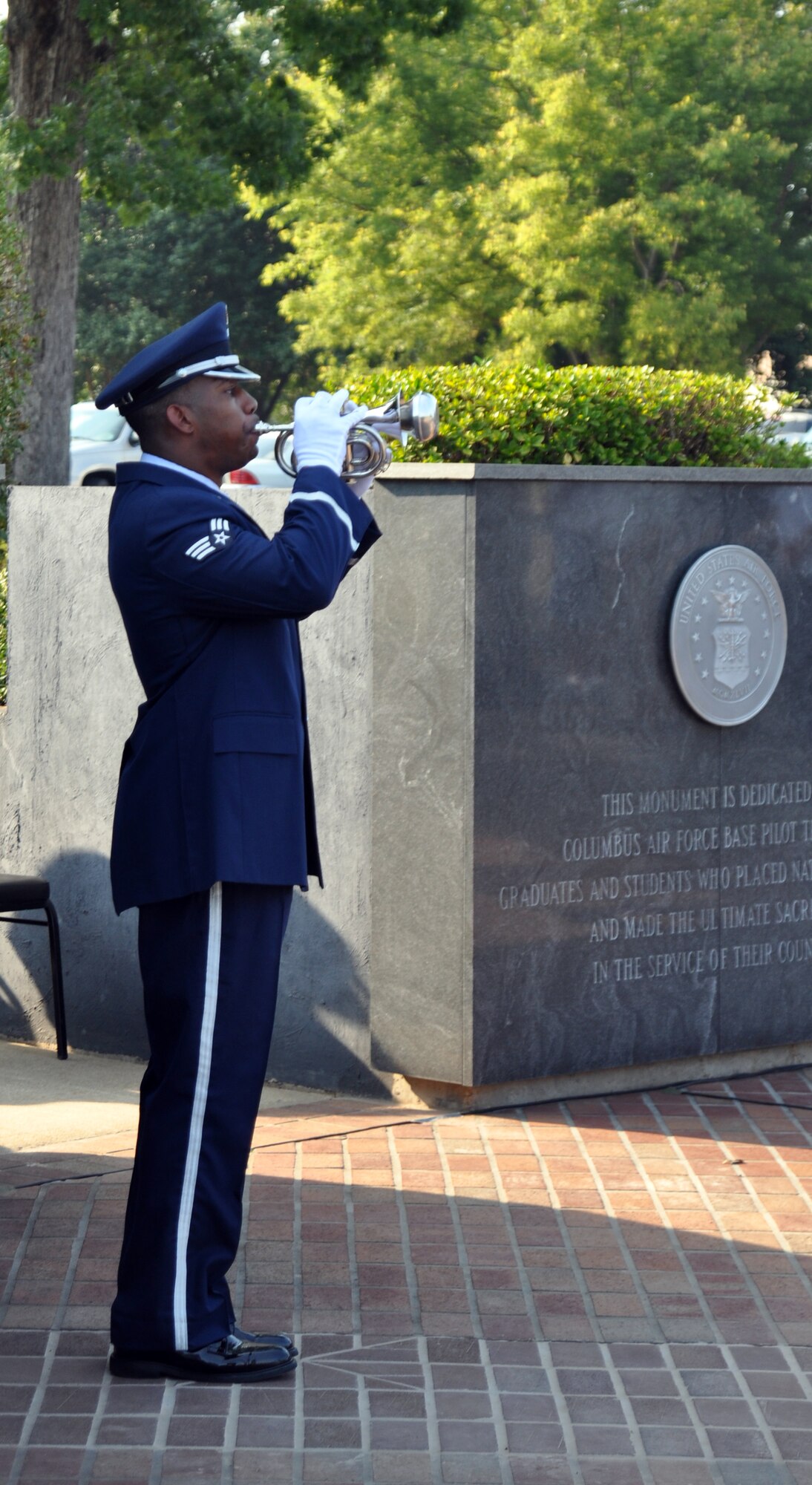Senior Airman Chris Jones, Columbus Air Force Base Honor Guard, plays the bugle at the POW/MIA Remembrance Ceremony, Sept. 17 at Columbus AFB’s Smith Plaza. The ceremony is held to honor and remember those declared prisoners of war or missing in action. (U.S. Air Force photo/Staff Sgt. Jacob Corbin).