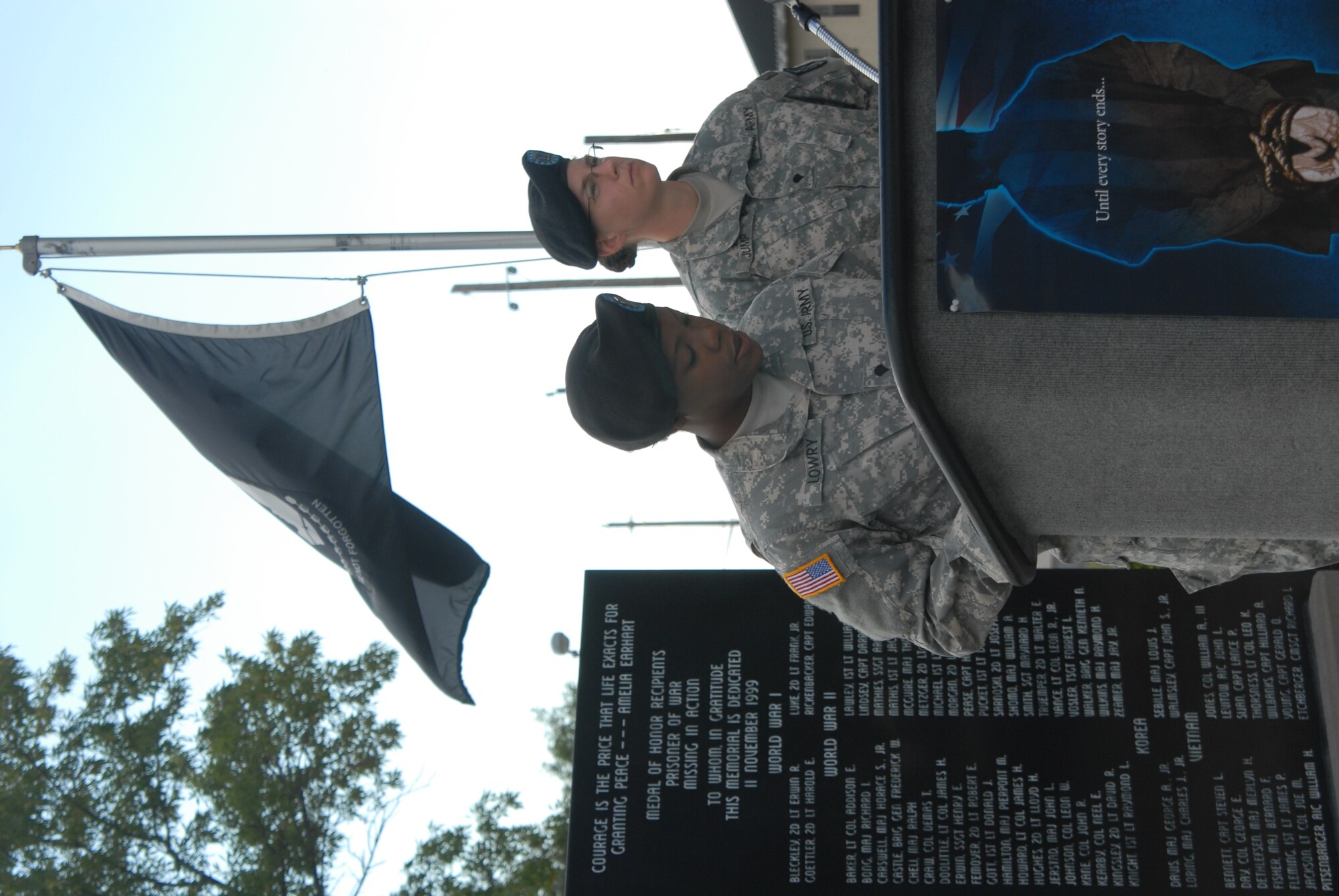 Army Specialist Rastassia Lowry and Specialist Sarah Jump, 229th MI BN Bravo Company, recite the names of Prisoners of War/Missing in Action servicemembers during a 24 hour vigil held at the POW/MIA memorial here Sept. 17. There are currently 1,741 POW/MIAs listed by the Defence Department. ( U.S. Air Force photo/Airman 1st Class Jessica D. Keith)