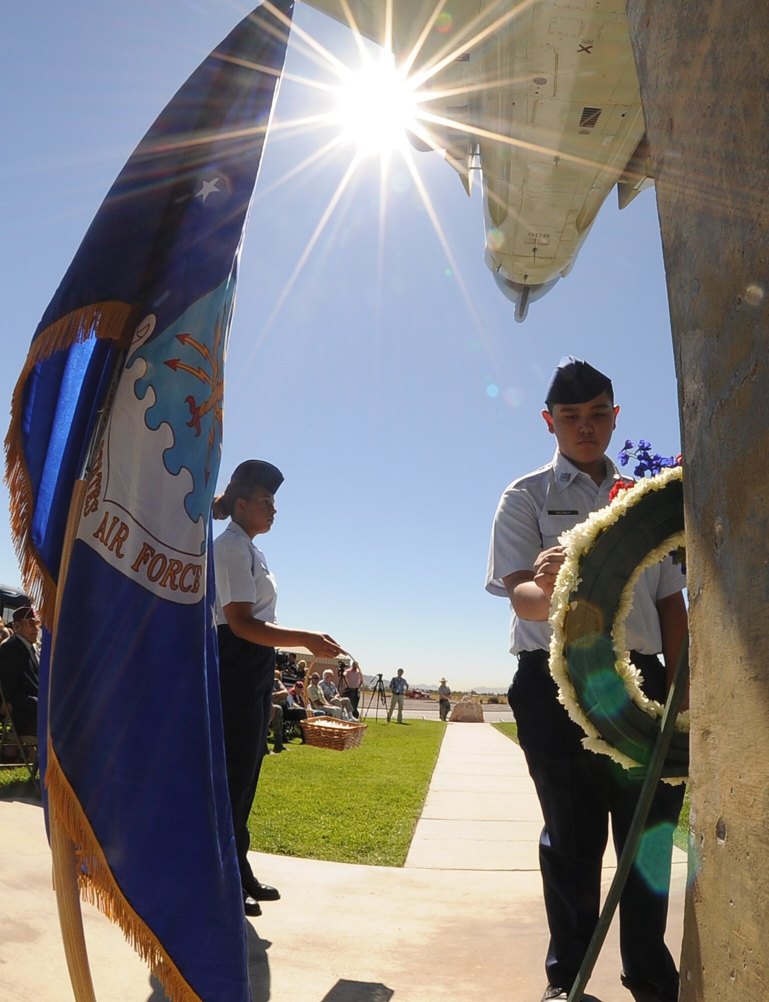 NELLIS AIR FORCE BASE, Nev.-- A cadet from the Rancho High School Air Force Junior Reserve Officers' Training Corps places a daisy on the memorial wreath in honor of Nevada veterans during a Prisoners of War/Missing in Action Recognition Day Ceremony at Freedom Park Sept. 17. (U.S. Air Force photo by Senior Airman Stephanie Rubi)