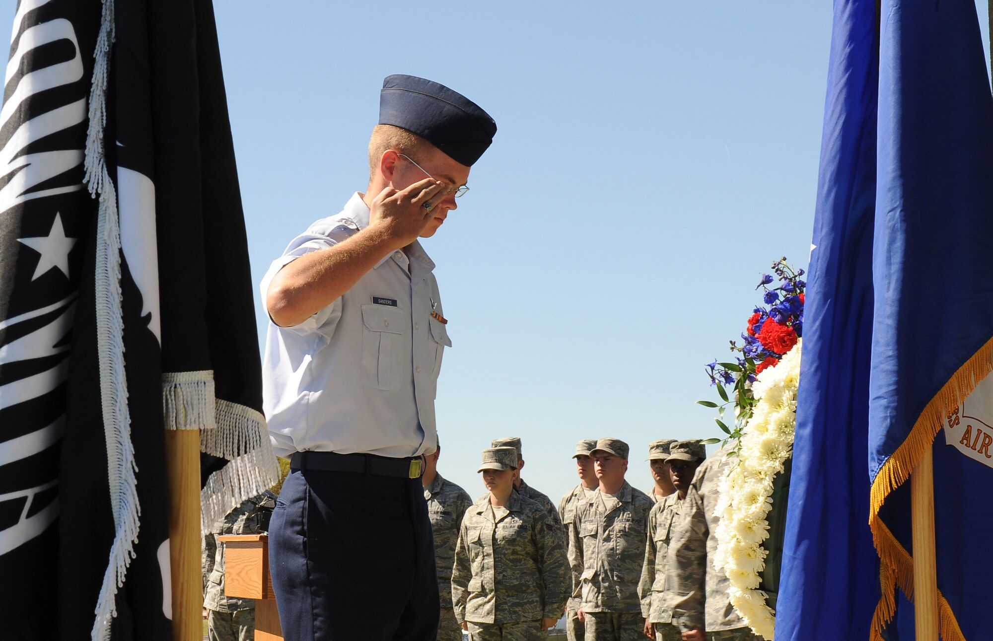 NELLIS AIR FORCE BASE, Nev.-- A cadet from the Rancho High School Air Force Junior Reserve Officers' Training Corps salutes the memorial wreath honoring veterans that are missing in action during a Prisoners of War/Missing in Action Recognition Day Ceremony Sept. 17 at Freedom Park. (U.S. Air Force photo by Senior Airman Stephanie Rubi)