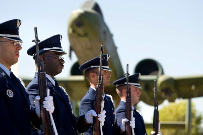 NELLIS AIR FORCE BASE, Nev. -- A Nellis Honor Guard firing party stands at attention prior to performing a three-volley salute during the National Prisoners of War/Missing in Action Recognition Day Ceremony at Freedom Park Sept. 17. (U.S. Air Force photo by Lawrence Crespo) 

