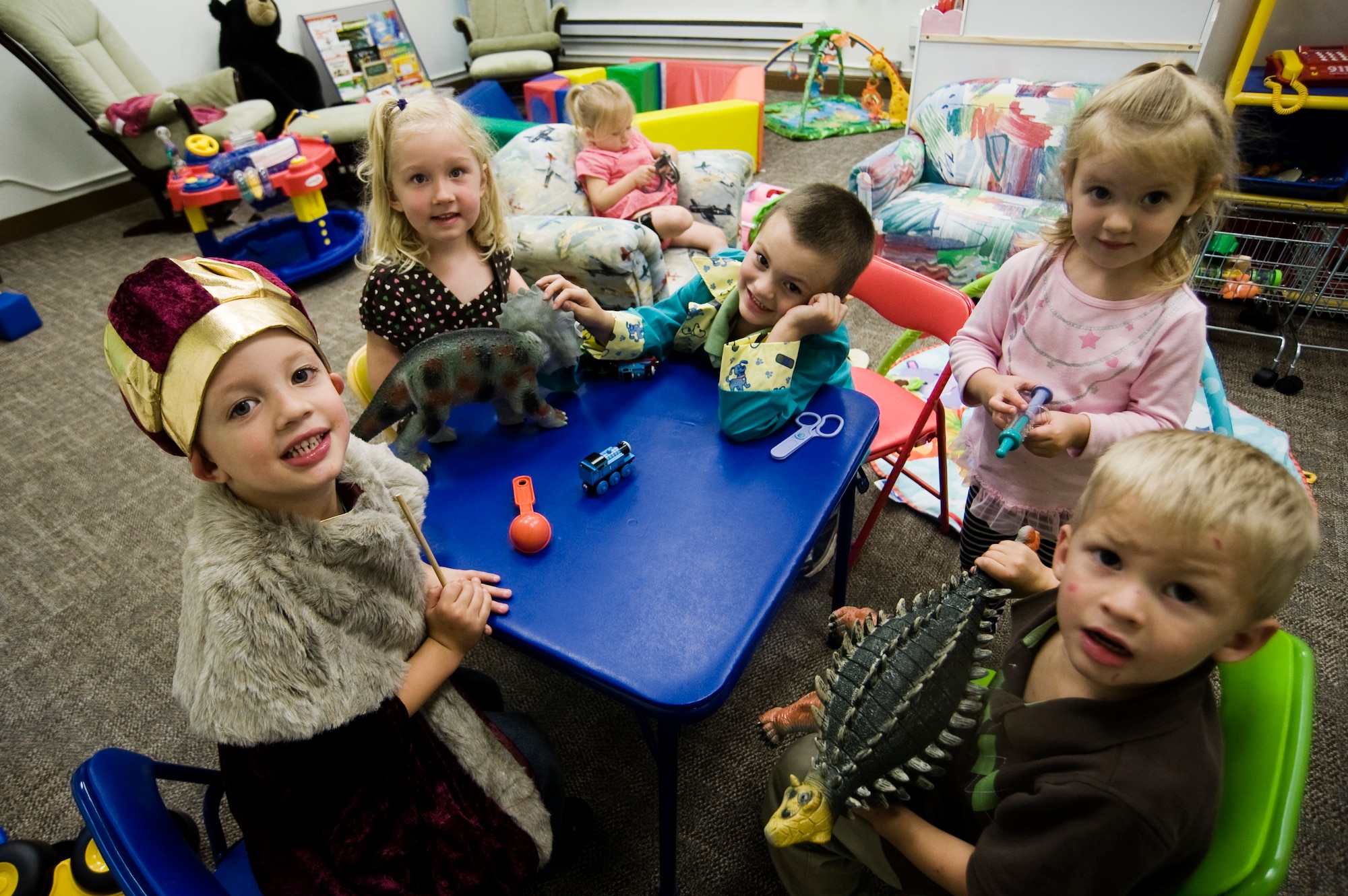 Children play dress up at the re opening of the Escape Zone Sept. 17 at Joint Base Lewis-McChord, Wash. The facility is fully operational and completely recovered from December 2009 water damage. (U.S. Air Force Photo/Abner Guzman)