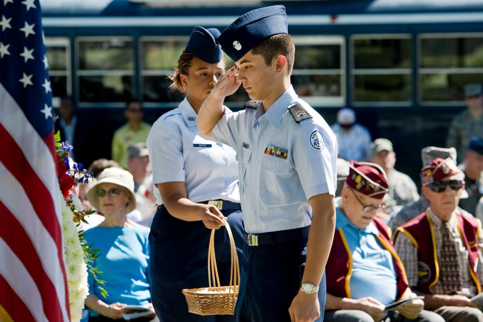 NELLIS AIR FORCE BASE, Nev.-- A cadet from the Rancho High School Air Force Junior Reserve Officers' Training Corps renders a salute after placing a daisy on the memorial wreath in honor of Nevada veterans during a Prisoners of War/Missing in Action Recognition Day Ceremony at Freedom Park Sept. 17. ( U.S. Air Force photo by Lawrence Crespo)


 