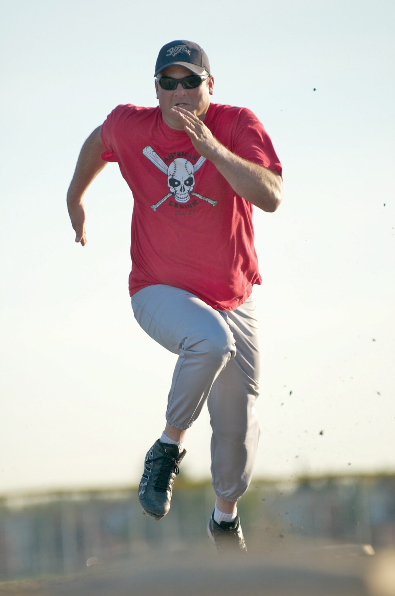 Andrew Spath, HHC, 725th Brigade Support Battalion, attempts to steal third base Monday night during game 1 at Buckner Field. Spath was narrowly beat to the bag by the ball. (Photo by David Bedard/JBER PAO)