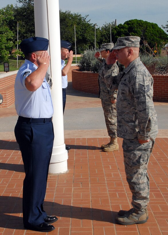 Volunteers for the POW/MIA Day Flag Vigil report and relieve the current detail Airmen Sept. 17 at the flag pole in front of the 82nd Training Wing command building at Sheppard Air Force Base, Texas.  More than 125 members of Team Sheppard volunteered to stand at parade rest under the POW/MIA and U.S. flags for a 10-minute rotation.  The vigil lasted from 7 a.m. to 5 p.m.  (U.S. Air Force photo/LouAnne Sledge)