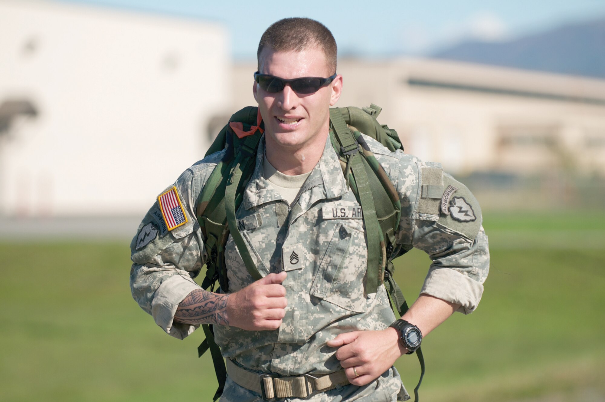 Army Staff Sgt. Jonathan Khan, C/3-509th, is the first to finish two miles with a 35-pound rucksack with a time of 15 minutes, 48 seconds. (Photo by David Bedard/JBER PAO)