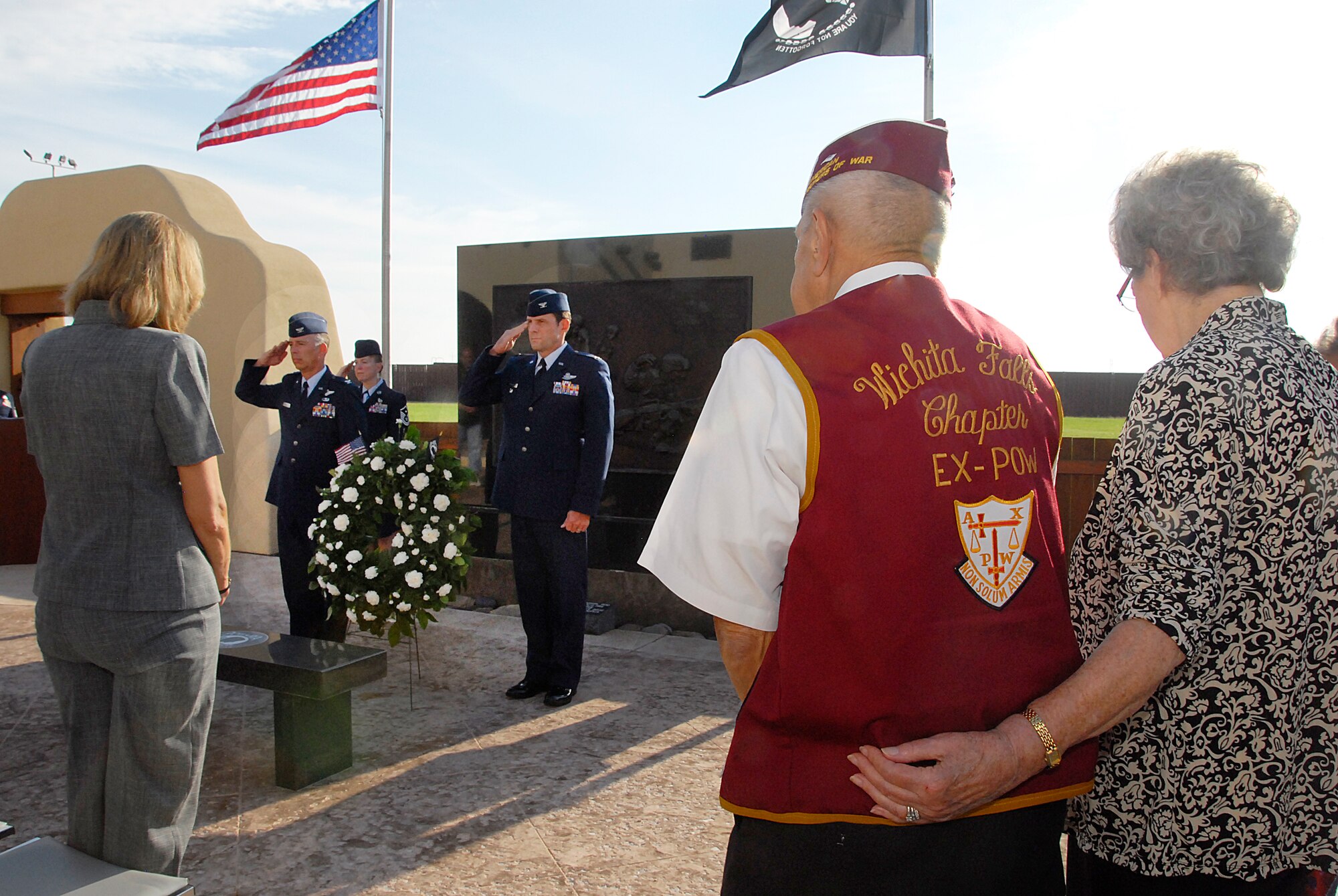 Col. Michael Hake (left) and Col. Tom Menker (right) place the wreath and render a salute during the Wreath-laying Ceremony Sept. 17 at the Heritage Center on Sheppard Air Force Base, Texas.  Colonel Hake, 82nd Training Wing vice commander, and Colonel Menker, 80th Flying Training Wing vice commander, led the attending audience in rendering proper customs and courtesies as “Taps” was playing.  (U.S. Air Force photo/Harry Tonemah).