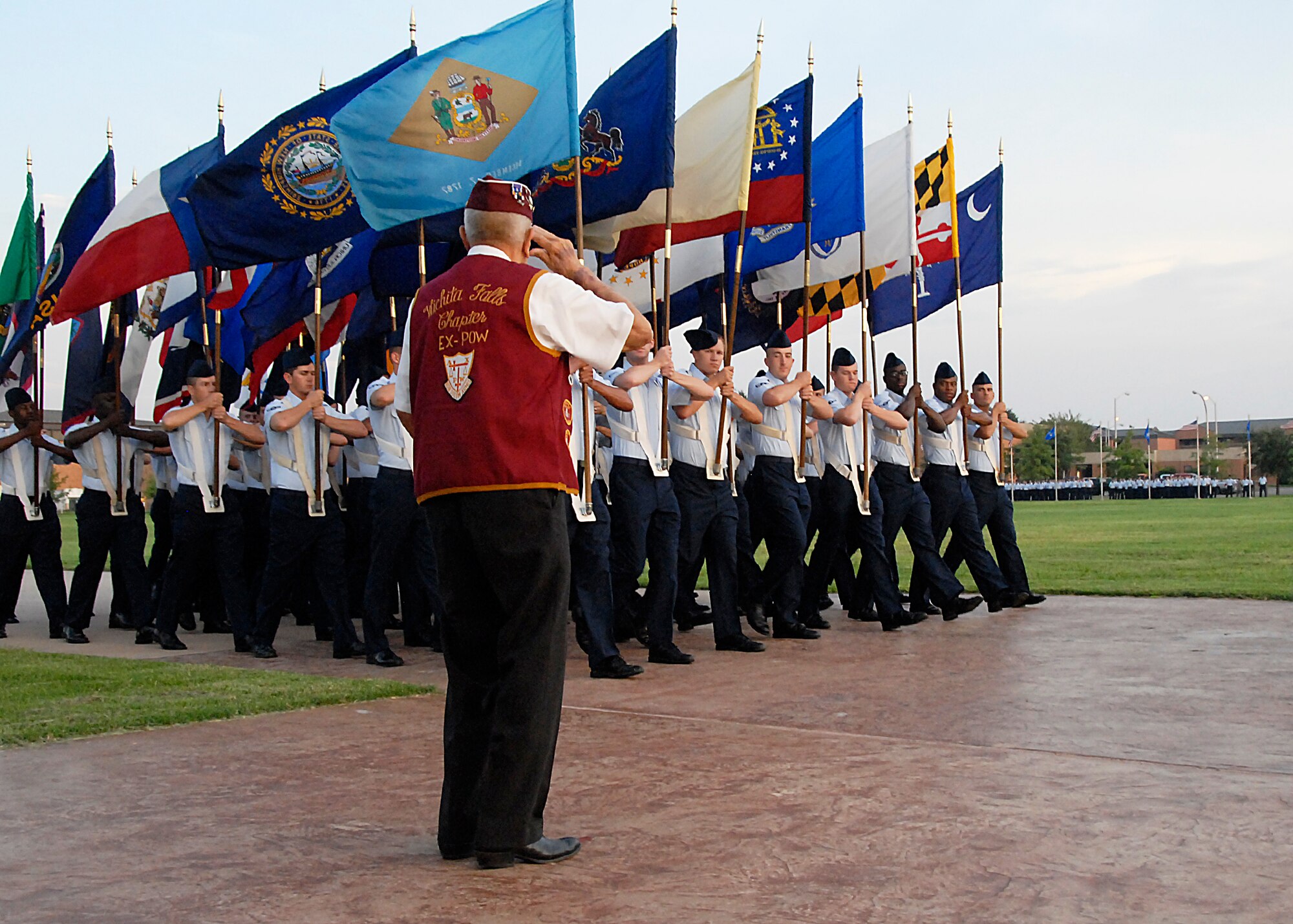 Retired Master Sgt. Charles Hartney renders a salute Sept. 17 as the members of Team Sheppard pass for review during the parade portion of POW/MIA Day at the parade field on Sheppard Air Force Base, Texas.  Mr. Hartney, former prisoner of war in Germany, served as the reviewing official for the parade.  (U.S. Air Force photo/Harry Tonemah)