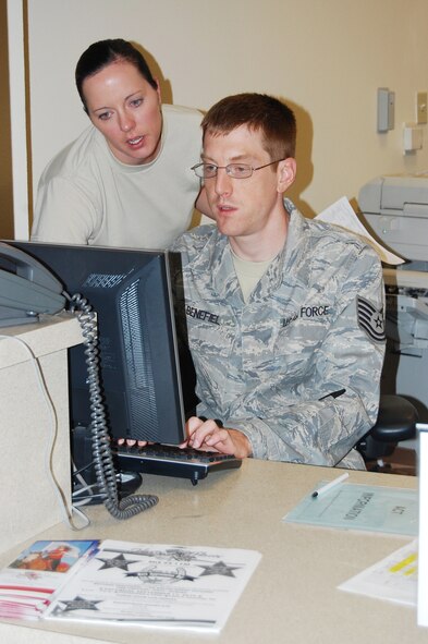 Master Sgt. Kaighen and Tech. Sgt. Benefiel research a patient's medical record during a unit training assembly Sept. 11. Sergeant Kaighen is an air reserve technician and NCO in charge of the 926th Aerospace Medicine Flight, and Sergeant Benefiel is a health services administrator with the 926th AMDF. Sergeant Benefiel was promoted to technical sergeant on Sept. 1.