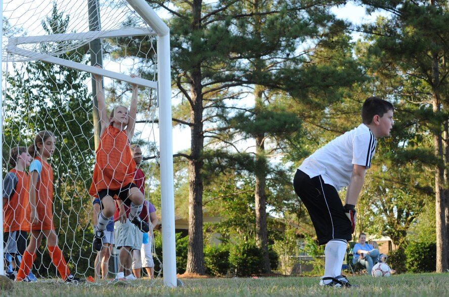 MOODY AIR FORCE BASE, Ga. – Brendon Brouillette, son of Tech. Sgt. Jasen Brouillette, 820th Security Forces Group, guards the goal during soccer practice here Sept. 16. The team took frequent hydration breaks to ensure they are prepared to play the entire game. (U.S. Air Force photo by Airman 1st Class Benjamin Wiseman)