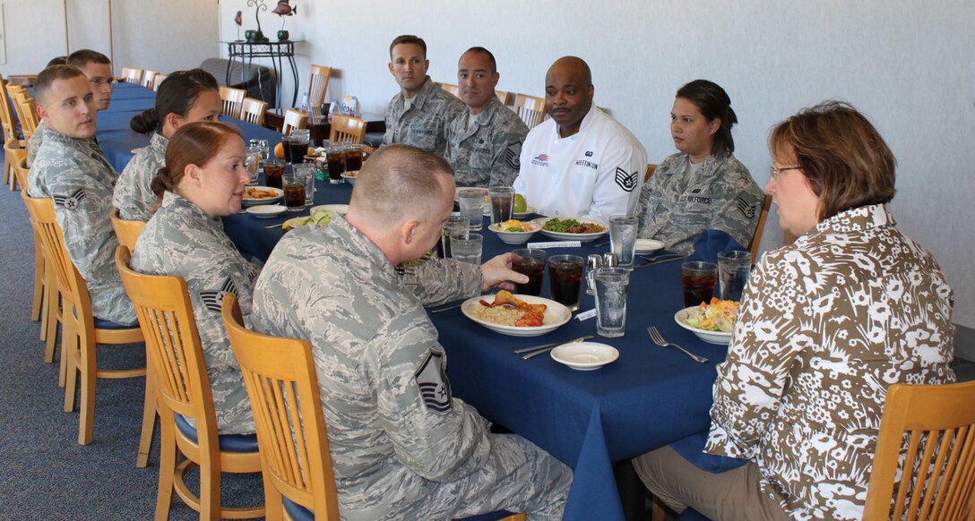 Janet Badgett, wife of Chief Master Sgt. Dwight D. Badgett who is the command chief of Air Force Reserve Command, talks with Airmen at the Patterson Dining Facility Sept. 11, 2010. Mrs. Badgett had lunch with several Liberty Wing Airmen during her visit to Dover Air Force Base. (U.S. Air Force photo byTech. Sgt. Christin Michaud/Released)