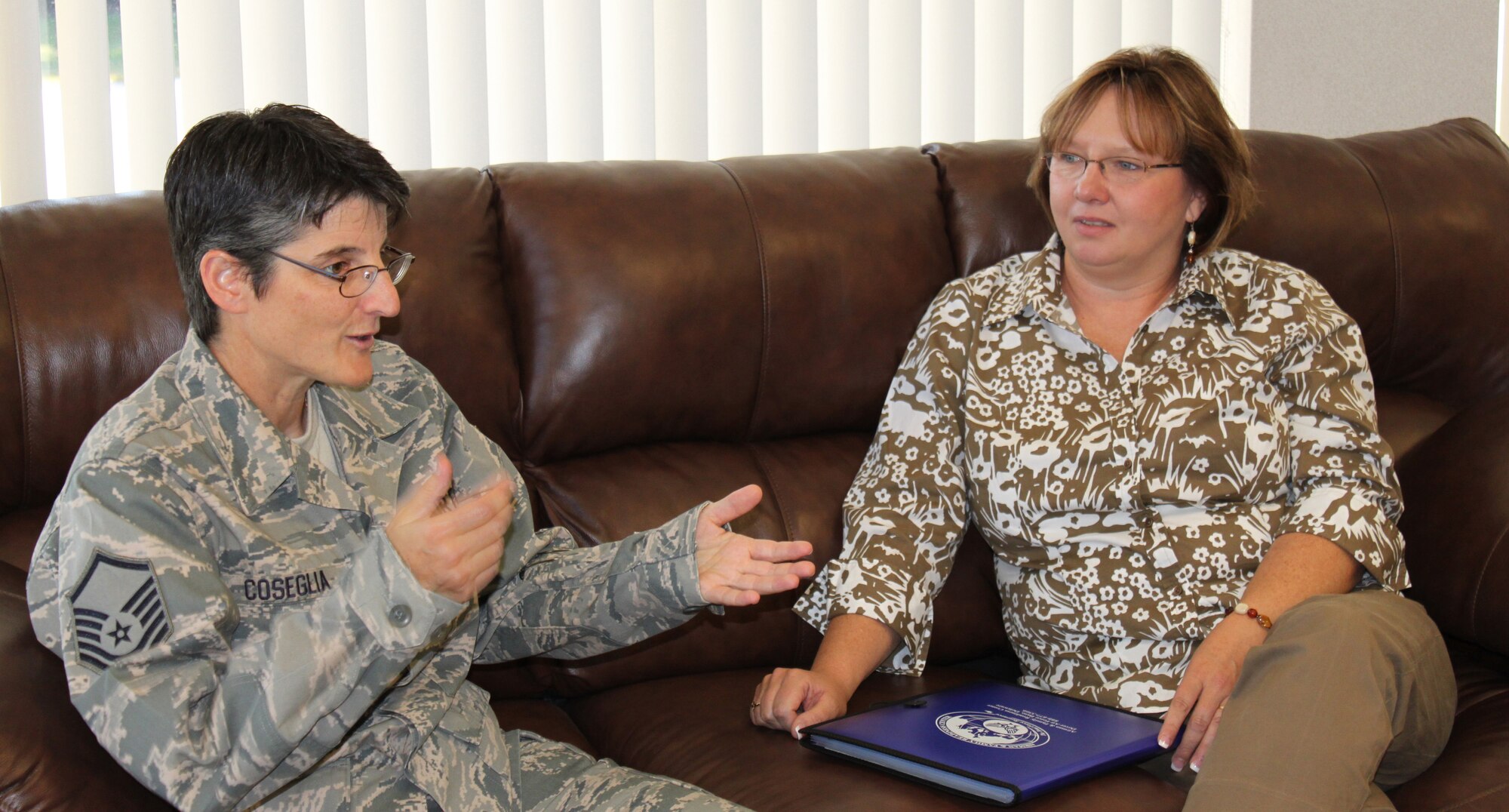 Master Sgt. Laura Coseglia, 512th Airman & Family Readiness director, highlights some of the A&FR programs to Janet Badgett, wife of Command Chief of the Air Force Reserve Command Chief Master Sgt. Dwight D. Badgett Sept. 11, 2010. Chief and Mrs. Badgett were here to attend the Airman?s Weekend and meet with Liberty Wing members during the September Unit Training Assembly.  (U.S. Air Force photo by Tech. Sgt. Christin Michaud/Released)