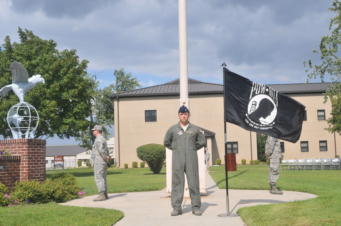 In honor of POW/MIA Recognition Day Sept. 17, 2010, 512th Airlift Wing members stand at parade-rest in an around-the-clock vigil at the flag pole on Dover Air Force Base, Del. Throughout the duty day, various groups of four individuals from around the base took turns, standing for a 10-minute time period. Facing front is Maj. Tim Morris, 709th Airlift Squadron; he is joined by Chief Master Sgt. Anthony Campbell, 712th Aircraft Maintenance Squadron, and Lt. Col. Thomas Guerra, 512th Operations Support Flight. (U.S. Air Force photo by Master Sgt. Veronica A. Aceveda/Released)