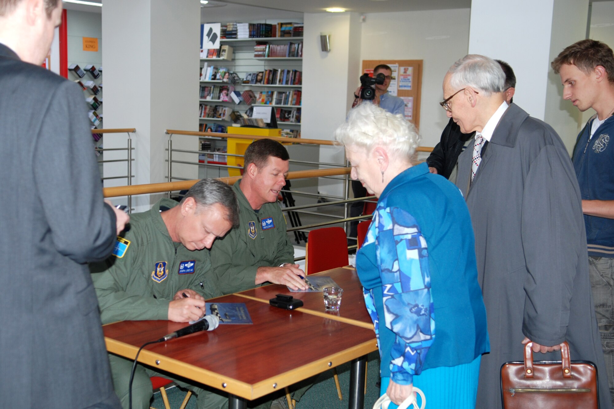 Lt. Col. Joseph Jones, 93rd Bomb Squadron commander, and Col. Keith Schultz, 917th Operations Group commander, sign autographs at a bookstore in Ostrava, Czech Republic, Sept. 17, 2010. Colonels Schultz and Jones made an historic flight to the Czech Republic in a 93rd BS B-52H Stratofortress in support of the 10th NATO Days in Ostrava & 1st Czech Air Force Days Air Show, which is scheduled for Sept 18-19, 2010, at the Leos Janacek Ostrava Airport, Ostrava, Czech Republic. The 93rd BS is assigned to the 917th Wing at Barksdale Air Force Base, La. (U.S. Air Force photo/Master Sgt. Greg Steele)