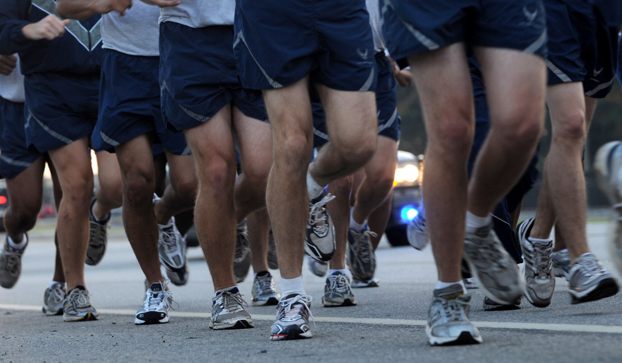 MOODY AIR FORCE BASE, Ga. -- Members participating in the first segment of this year’s Prisoner of War/Missing in Action Recognition Day run keep in stride here Sept. 17. Each group of runners had a police escort to ensure that the members could safely participate in the run. (U.S. Air Force photo/Airman 1st Class Benjamin Wiseman)