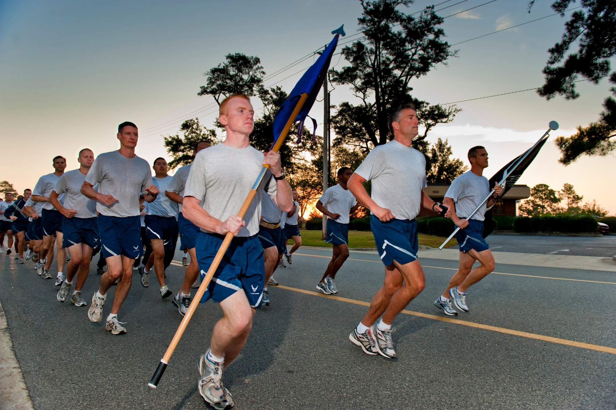 MOODY AIR FORCE BASE, Ga. -- Members of the 23rd Wing staff agencies make their way down George Street  here Sept. 17, officially starting this year's Prisoner of War/Missing in Action Recognition Day run. Participating units each ran a mile before passing the POW/MIA guidon to the next group. The base ran a total of 23 miles in honor of all POWs and MIA, past and present. (U.S. Air Force photo/Senior Airman Jamal D. Sutter)