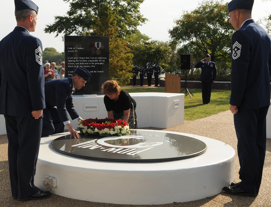 LANGLEY AIR FORCE BASE, Va. – Col. Matt Molloy, 1st Fighter Wing commander, and Sonja Dillaman, daughter of prisoner of war John Langley James, lay a ceremonial wreath on the POW/MIA memorial Sept. 17.  Team Langley honored our nation’s POWs and missing in action through a series of ceremonies and events Sept. 16 and 17, paying respect to those who made, and continue to make, the ultimate sacrifice. (U.S. Air Force photo/Staff Sgt. Tabitha Kuykendall) (RELEASED)