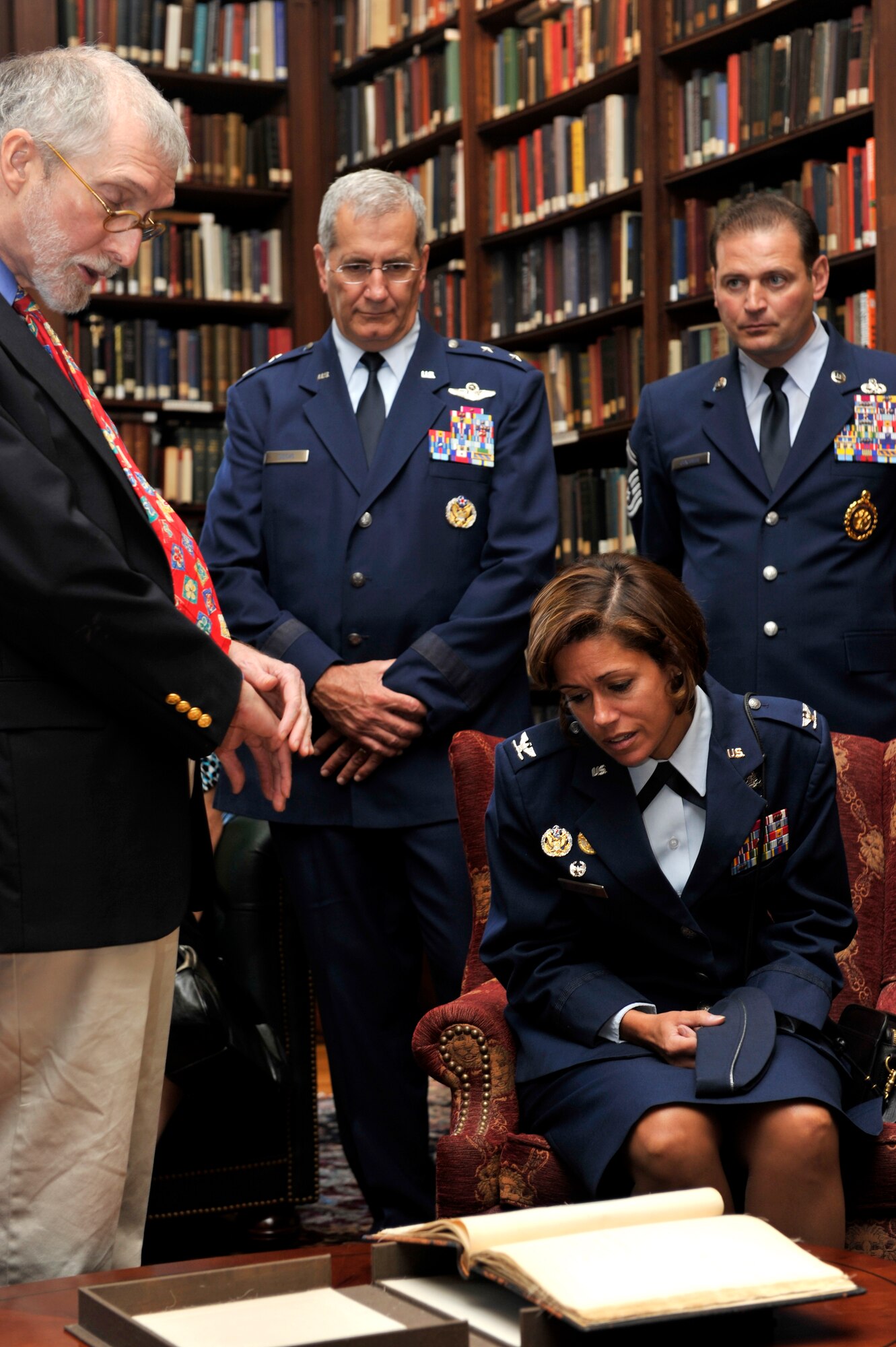 PHILADELPHIA, Penn. -- Mr. David Cassidy, curator for the Union League of Philadelphia, displays historic documents for Col. Gina Grosso, commander 87th Air Base Wing, Maj. Gen. Stephen Sischo, deputy adjutant general-air, Pennsylvania National Guard and Senior Master Sgt. Matthew Giacobbe, superintendent for recruiting and retention, Penn. Air National Guard, during a tour of the facility in commemoration of the 63rd birthday of the United States Air Force hosted by the Armed Services Council of the Union League of Philadelphia, Sep. 15, 2010. Airmen from Willow Grove Joint Air Reserve Station and Joint Base McGuire-Dix-Lakehurst were in attendance for the celebration where Chaplain (Maj. Gen.) Cecil R. Richardson, chief of chaplains for the U.S. Air Force, gave the keynote address.  (U.S. Air Force photo by TSgt Laura K. Deckman)(released)