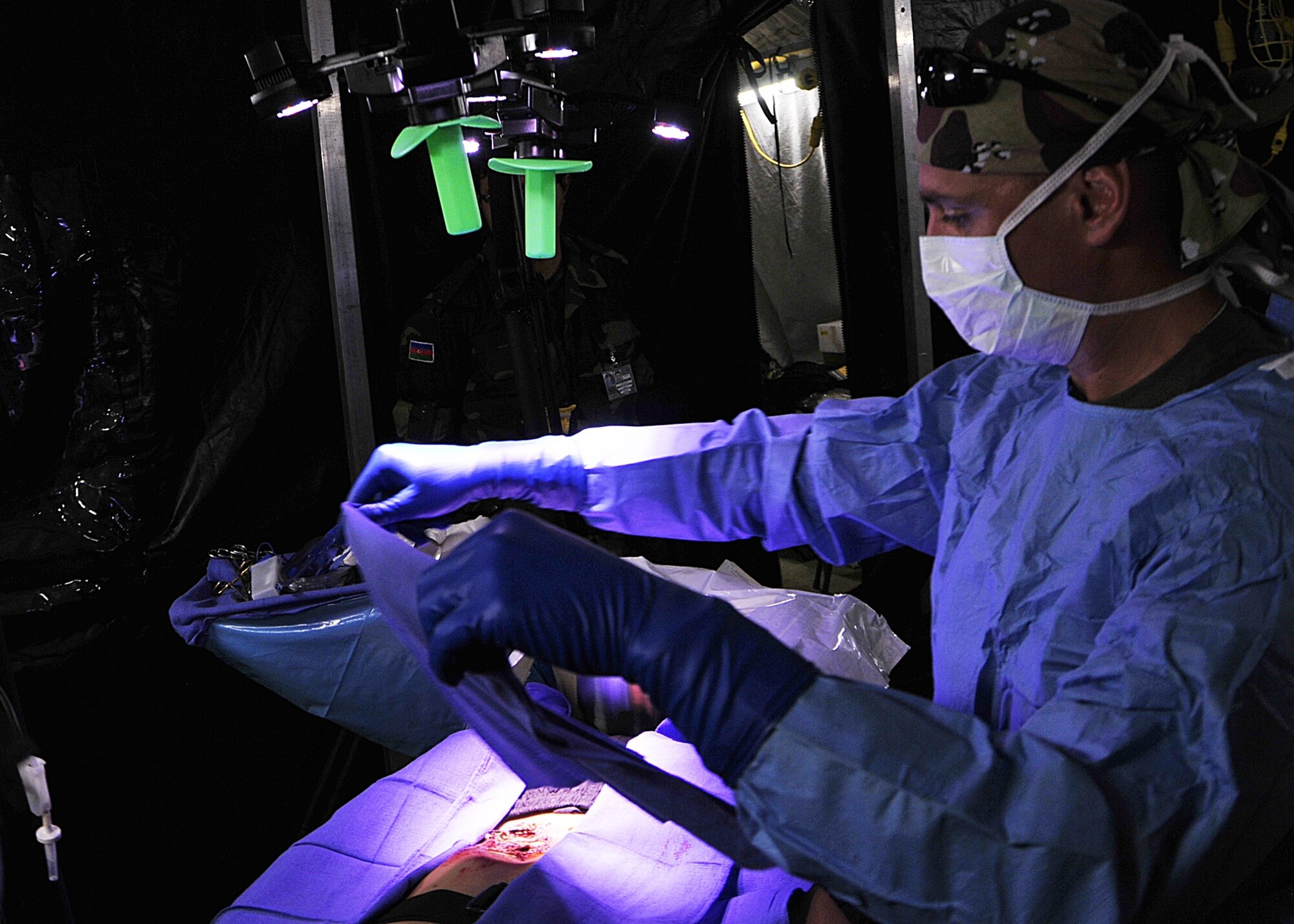 Ukrainian armed forces Lt. Col. Konstantin Gumenyuk, surgeon, places surgical cloth around a mock victim's wounds during MEDCEUR 10, a medical training exercise in central and eastern Europe, at Danilovgrad Army Base, Montenegro, Sept. 16. Colonel Gumenyuk, along with more than 250 other medical servicemembers from ten nations work, train and learn with one another so that they will be capable of responding to real world situations more efficiently. For more information, go to www.usafe.af.mil/medceur.asp and www.odbrana.gov.me. (U.S. Air Force photo/Airman 1st Class Tiffany Deuel)