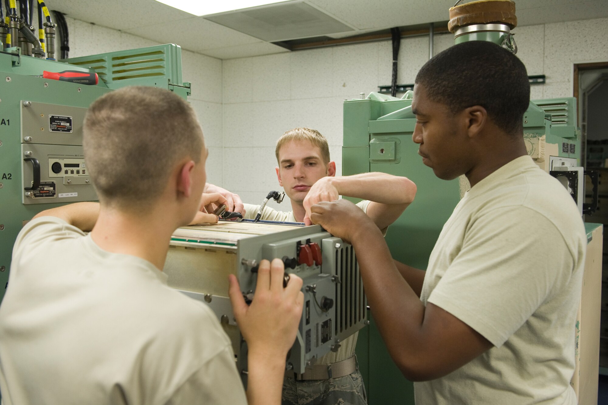 The Global Strike Challenge Missile Communications Team troubleshoots a piece of equipment during training for the upcoming competition. (U.S. Air Force photo/Beau Wade)