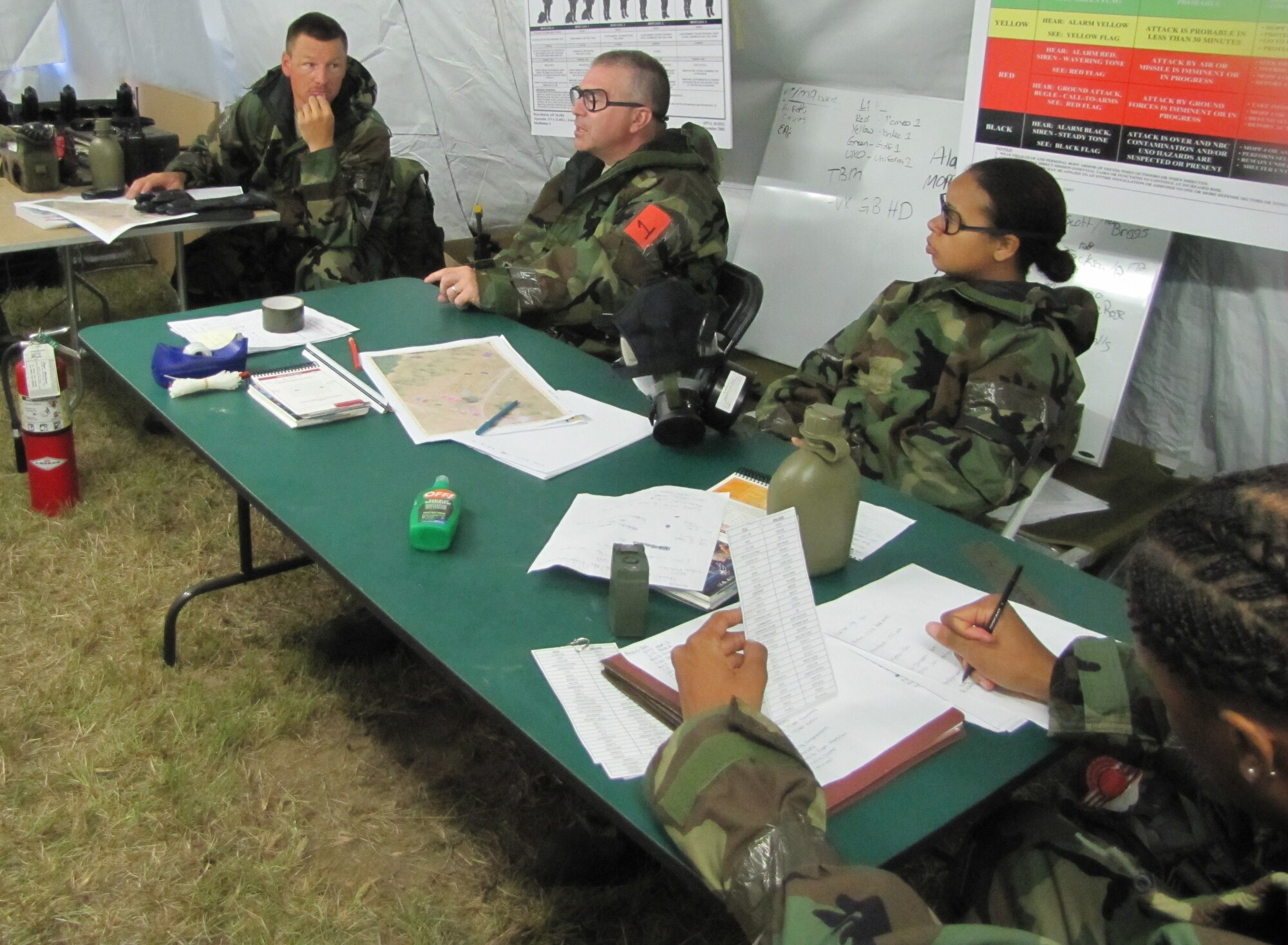 Col. Daniel Leveille, 560th RED HORSE Squadron commander, Tech. Sgt. Bill Fee, 560 RHS security forces member, and Senior Airman Xiomara Verdejom, 560 RHS emergency management member, man the command post tent during their annual field training exercise Sept. 10-13, 2010 at North Auxiliary Air Field S.C. (U.S. Air Force photo/Tech. Sgt. Steve Wells)