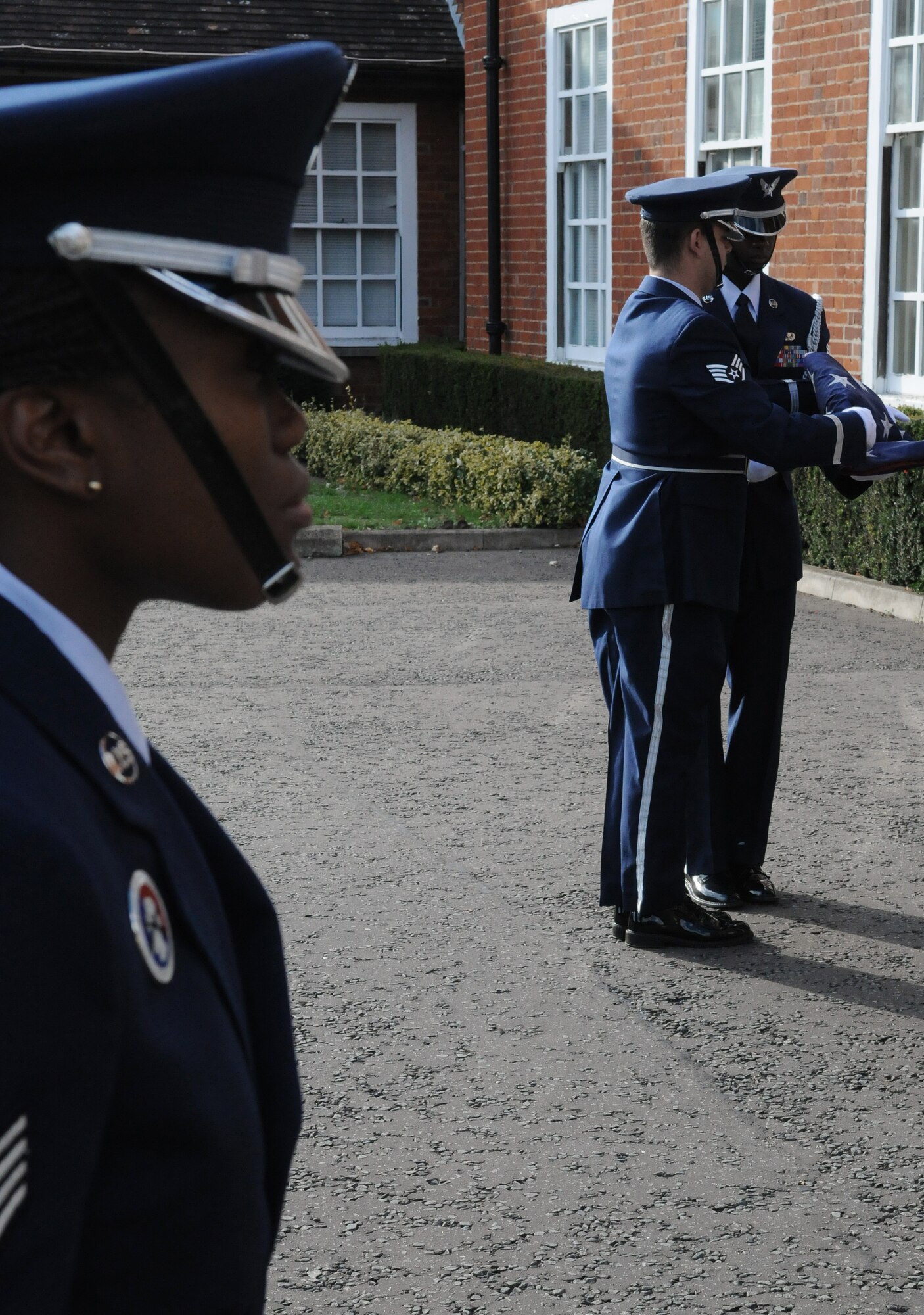 RAF MILDENHALL, England -- A base honorgaurdsman stands in a flag security detail while the colors are secured in a special Retreat outside 100th Air Refueling Wing headquarters Sept. 17. This was the final event of Prisoner of War/Missing in Action Remembrance Week. (U.S. Air Force photo/Staff Sgt. Thomas Trower) 