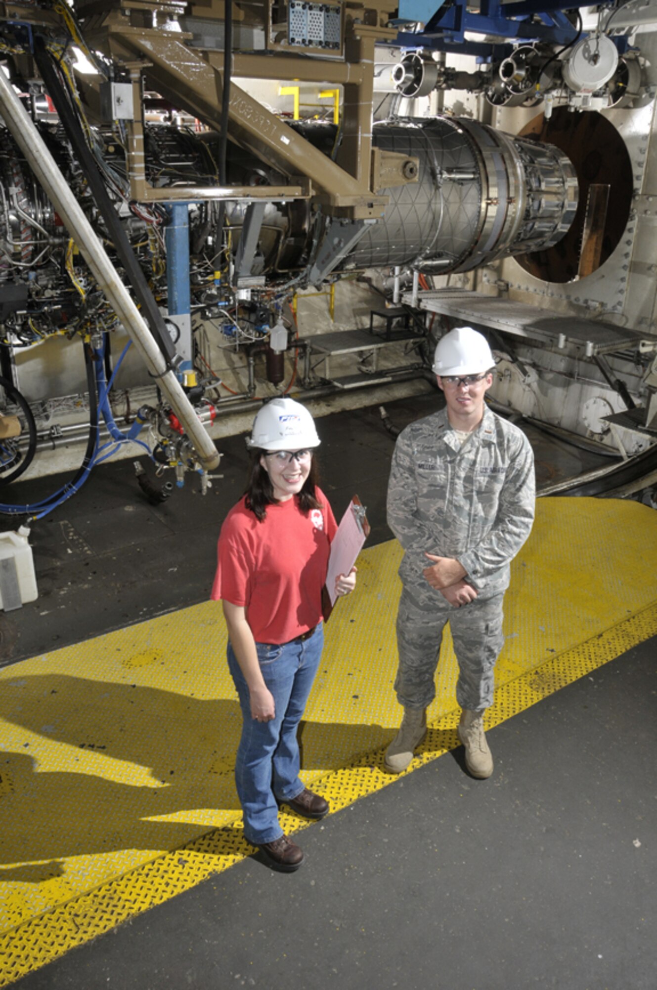 Aerospace Testing Alliance Project Engineer Patricia Oberdorf, and 2nd Lt. Drew Miller are responsible for successfully executing the current series of F100 engine alternative fuel tests. (Photo by Rick Goodfriend)