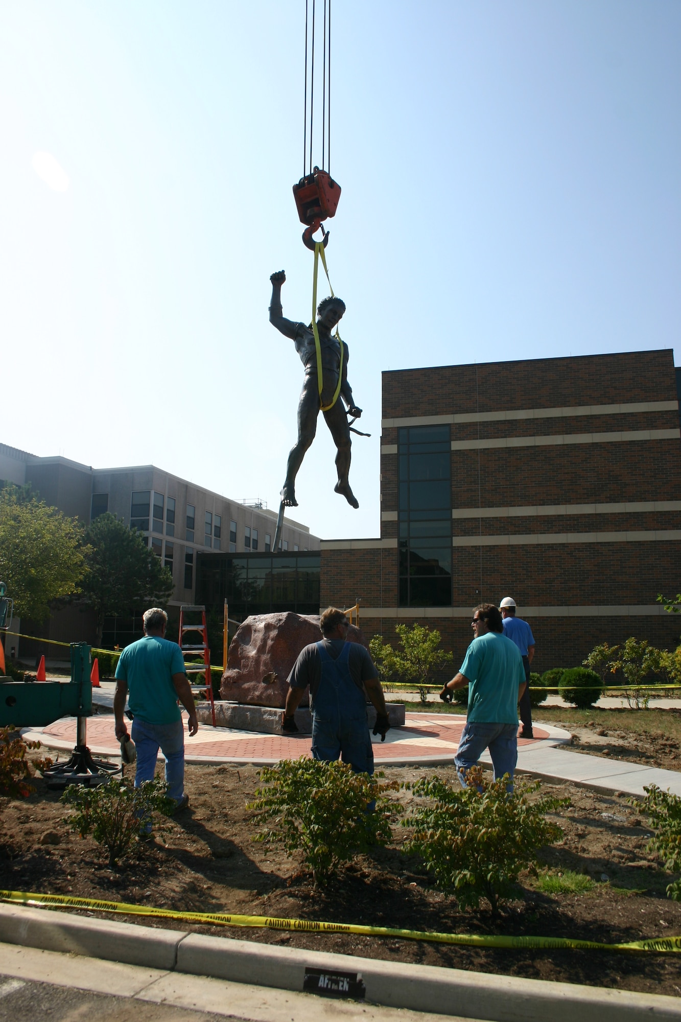 The Icarus statue is lifted to its new home on the Air Force Institute of Technology's campus Sept. 7, 2010, after spending the past 12 years in the lobby of the National Museum of the United States Air Force at Wright-Patterson Air Force Base. The statue was a gift from the AFIT Foundation. (U.S. photo/Bob Memering) 