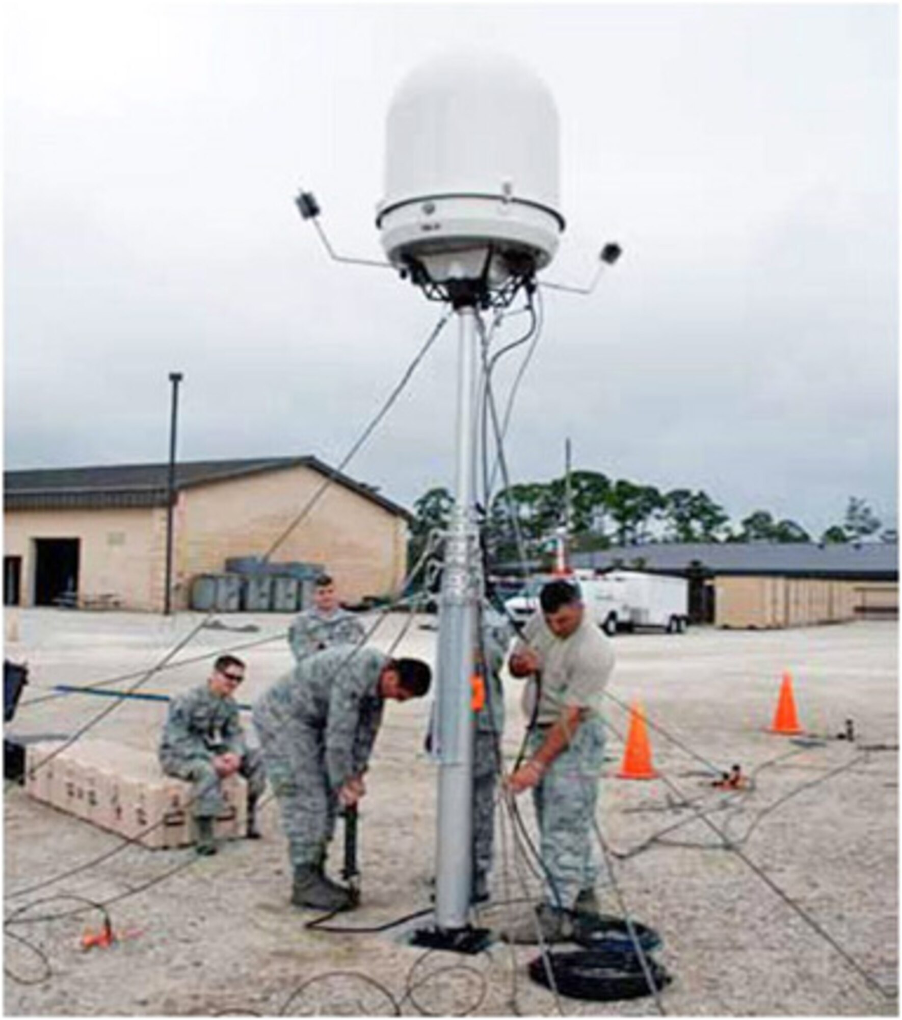 Airmen set up a portable Doppler radar system. The Electronic Systems Center is working to bring the improved capabilities the system offers to warfighters. (Courtesy photo)