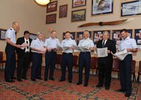 Senior leaders from Joint Base San Antonio look over the 2010 Agency Brochure for the Combined Federal Campaign during the CFC kickoff breakfast Sept. 13. This year's campaign continues through Oct. 31. (U.S. Air Force photo/Alan Boedeker)