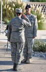 LAUGHLIN AIR FORCE BASE, Texas – Maj. Ian Dinesen, 47th Security Forces Squadron commander, passes his duties of standing guard over a POW/MIA remembrance wreath to Master Sgt. Laurie Freeman, 85th Flying Training Squadron, at Laughlin’s Heritage Park Sept. 17. The vigil was part of Laughlin’s POW/MIA Recognition Day activities, which also included a roundtable discussion with a former prisoner of war and three other Vietnam veterans who were shot down in action as well as a retreat ceremony. (U.S. Air Force photo by Airman 1st Class Blake Mize)