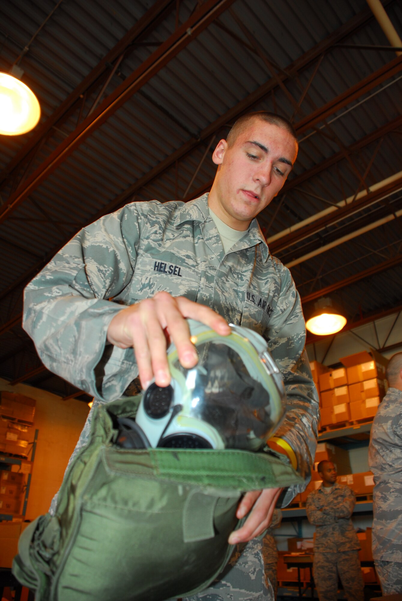 Airman Basic Shaun Hesel, 914th Civil Engineering Squadron operations management, inspects chemical training gear during an exercise September 11, 2010.  Airman Hesel performs inspections on required gear to make sure everything is operational.  All gear and deployment folders are inspected to ensure Airmen are ready to deploy at a moment’s notice.    (U.S. Air Force Photo by Senior Airman Jessica Snow)