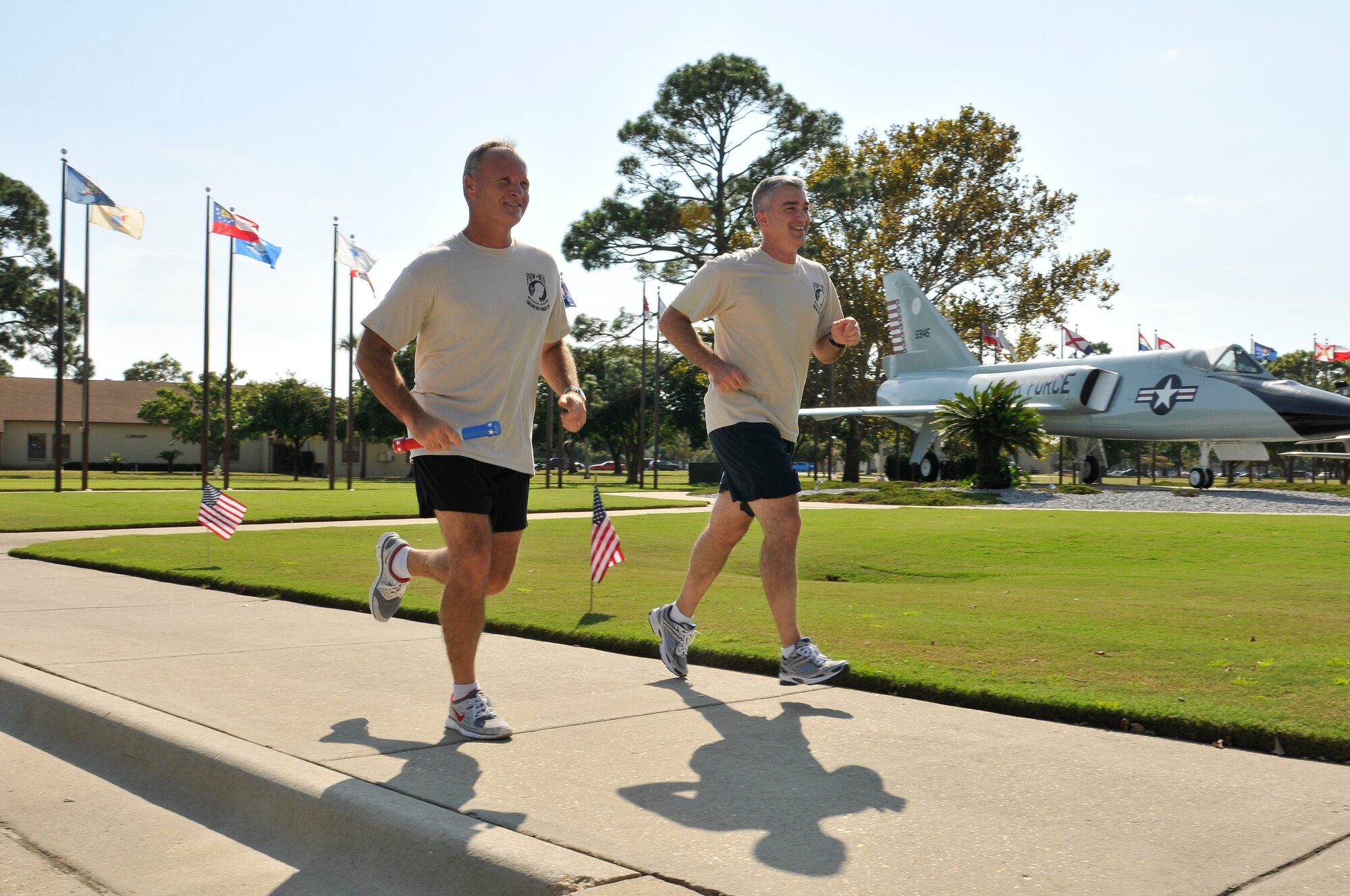 Brigadier Gen. James Browne, 325th Fighter Wing commander, and Chief Master Sgt. Jackie Green, 325th FW command chief, kicked-off the 2010 annual POW/MIA vigil run Sept. 17. The 24-hour run is held each year in honor of National POW/MIA Recognition day and is concluded with a retreat ceremony. (U.S. Air Force photo by Lisa Norman)