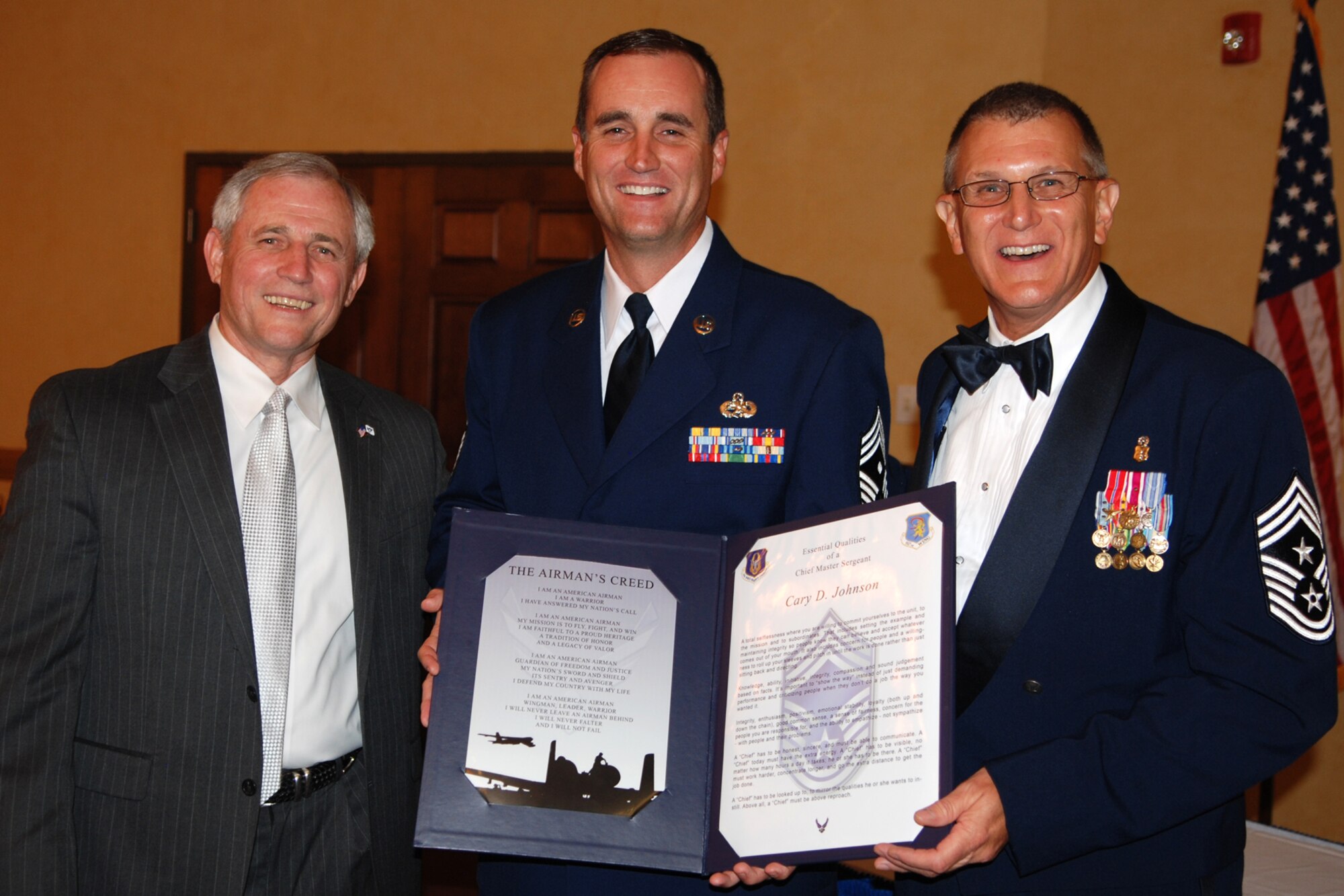Chief Master Sgt. Cary D. Johnson poses for a photo flanked by Chief Master Sgt. (Ret) Jack Skaggs and 917th Wing, Command Chief Master Sergeant Keith St. Aubin during the 917th Wing’s 7th Annual Senior Noncommissioned Officer Induction and Chief’s Recognition Ceremony at the Barksdale Club on Barksdale Air Force Base, La., Sept. 11, 2010. Chief Skaggs, who is a former Command Chief Master Sergeant of the 917th Wing, served as guest speaker for the event and spoke on the subject of leadership and the added responsibility of becoming a SNCO in today’s Air Force. More than 37 Master Sergeants were scheduled to be inducted while three Chief Master Sergeants were recognized at the ceremony. (U.S. Air Force photo/Master Sgt. Greg Steele)