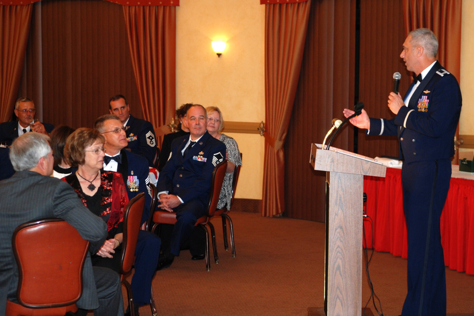 Col. John J. Mooney III, commander of the 917th Wing addresses the crowd during the 917th Wing’s 7th Annual Senior Noncommissioned Officer Induction and Chief’s Recognition Ceremony at the Barksdale Club on Barksdale Air Force Base, La., Sept. 11, 2010. More than 37 Master Sergeants were scheduled to be inducted while three Chief Master Sergeants were recognized at the ceremony. (U.S. Air Force photo/Master Sgt. Greg Steele)
