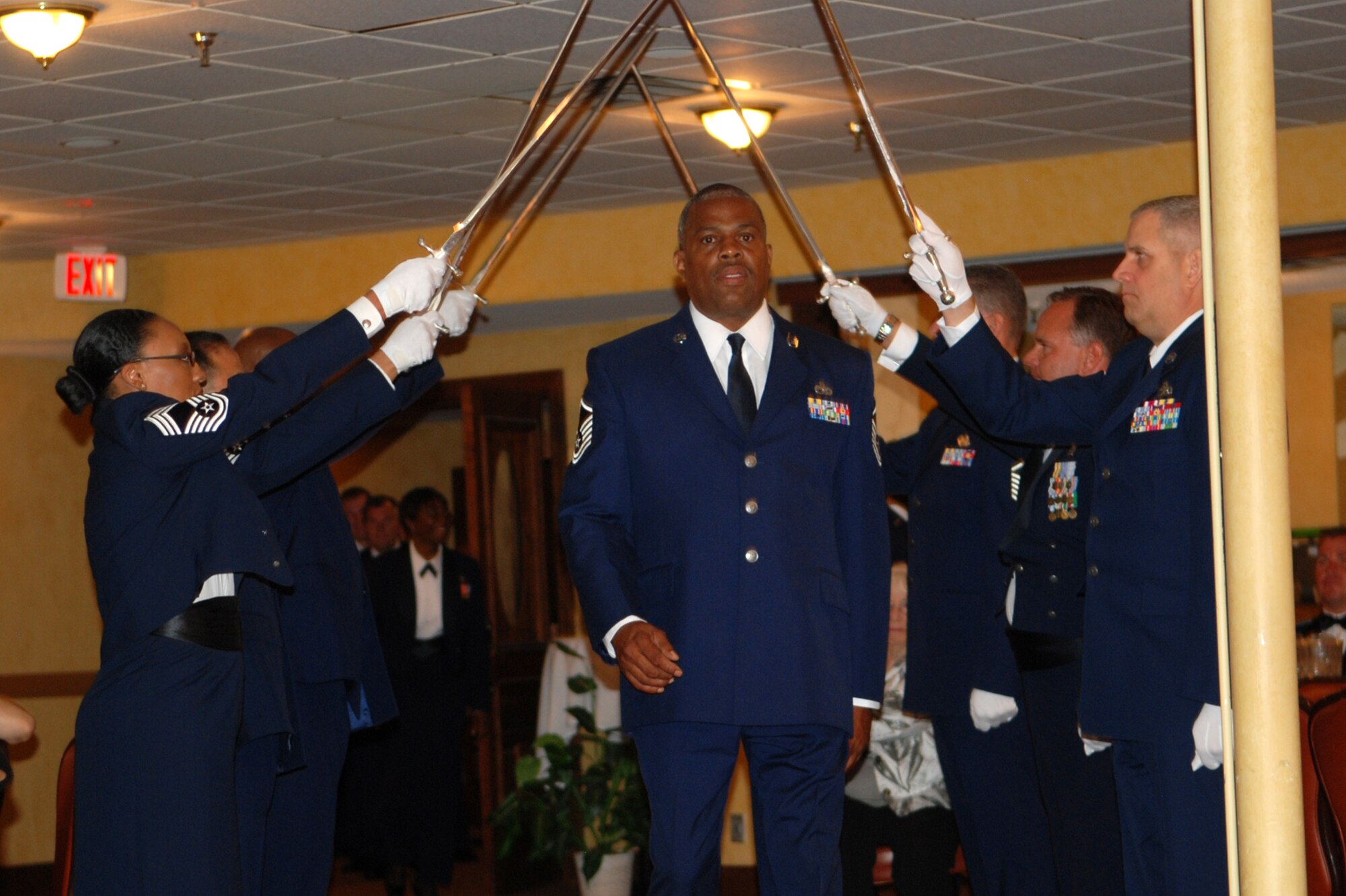 Master Sgt. Christopher A. Brown, 917th Maintenance Squadron, walks the saber cordon during the 917th Wing’s 7th Annual Senior Noncommissioned Officer Induction and Chief’s Recognition Ceremony at the Barksdale Club on Barksdale Air Force Base, La., Sept. 11, 2010. Chief Skaggs, who is a former Command Chief Master Sergeant of the 917th Wing, served as guest speaker for the event and spoke on the subject of leadership and the added responsibility of becoming a SNCO in today’s Air Force. More than 37 Master Sergeants were scheduled to be inducted while three Chief Master Sergeants were recognized at the ceremony. (U.S. Air Force photo/Master Sgt. Greg Steele)