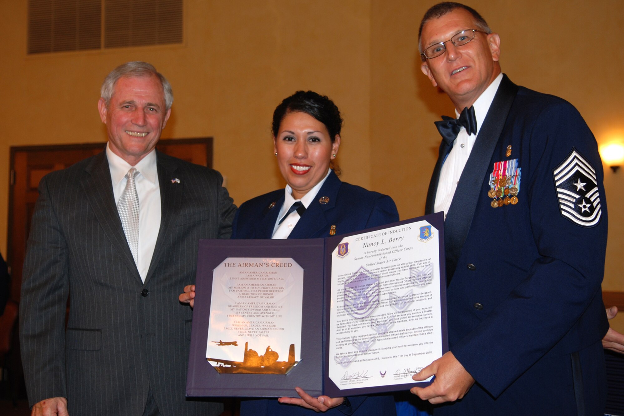 Master Sgt. Nancy L. Berry, optometry assistant for the 917th Medical Squadron, poses for a photo flanked by Chief Master Sgt. (Ret) Jack Skaggs and 917th Wing, Command Chief Master Sergeant Keith St. Aubin during the 917th Wing’s 7th Annual Senior Noncommissioned Officer Induction and Chief’s Recognition Ceremony at the Barksdale Club on Barksdale Air Force Base, La., Sept. 11, 2010. Chief Skaggs, who is a former Command Chief Master Sergeant of the 917th Wing, served as guest speaker for the event and spoke on the subject of leadership and the added responsibility of becoming a SNCO in today’s Air Force. More than 37 Master Sergeants were scheduled to be inducted while three Chief Master Sergeants were recognized at the ceremony. (U.S. Air Force photo/Master Sgt. Greg Steele)