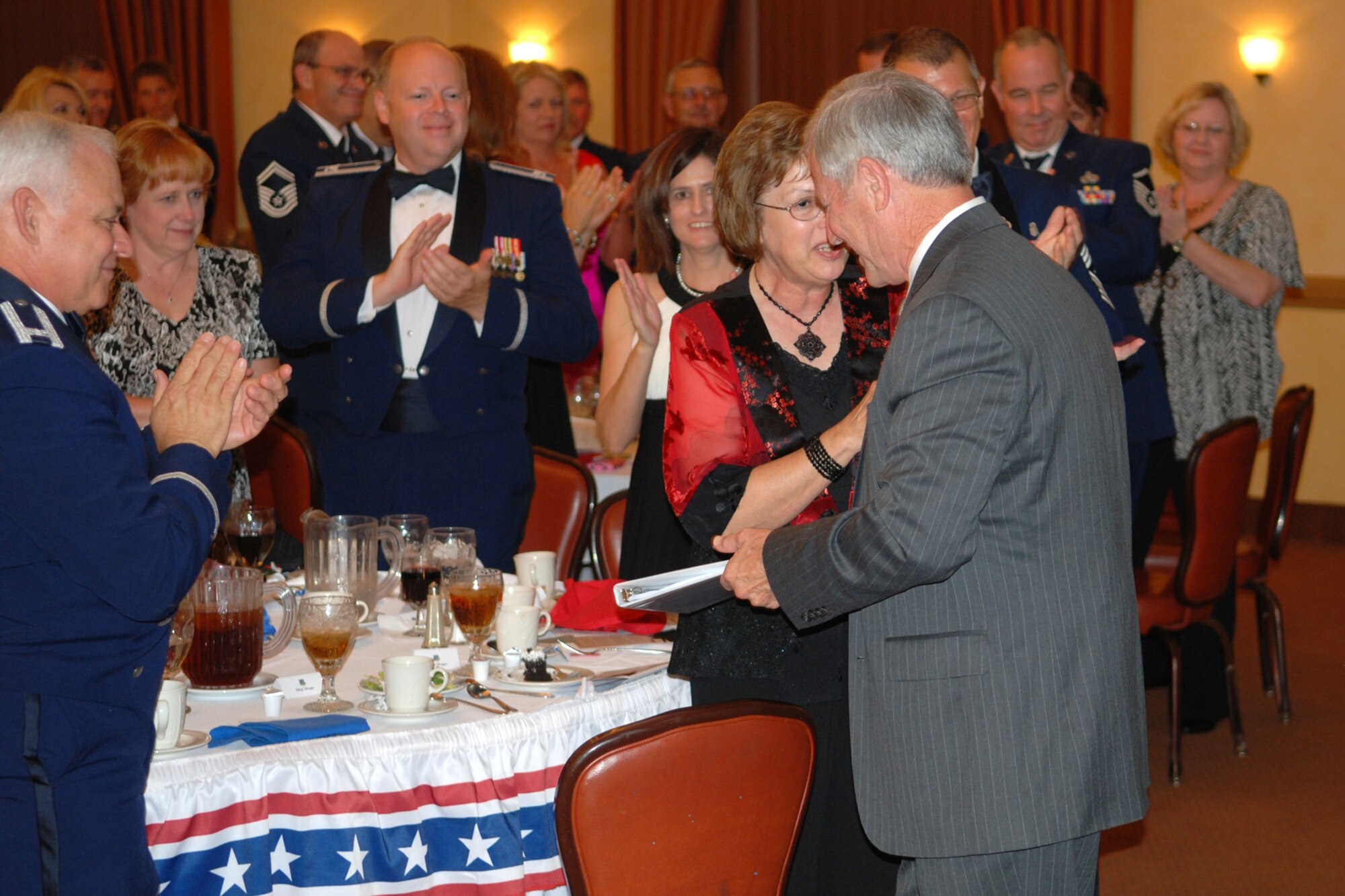Chief Master Sgt. (Ret) Jack Skaggs receives a standing ovation from the crowd after his speech on leadership during the 917th Wing’s 7th Annual Senior Noncommissioned Officer Induction and Chief’s Recognition Ceremony at the Barksdale Club on Barksdale Air Force Base, La., Sept. 11, 2010. Chief Skaggs, who is a former Command Chief Master Sergeant of the 917th Wing, spoke about leadership and the added responsibility of becoming a SNCO in today’s Air Force. More than 37 Master Sergeants were scheduled to be inducted while three Chief Master Sergeants were recognized at the ceremony. (U.S. Air Force photo/Master Sgt. Greg Steele)